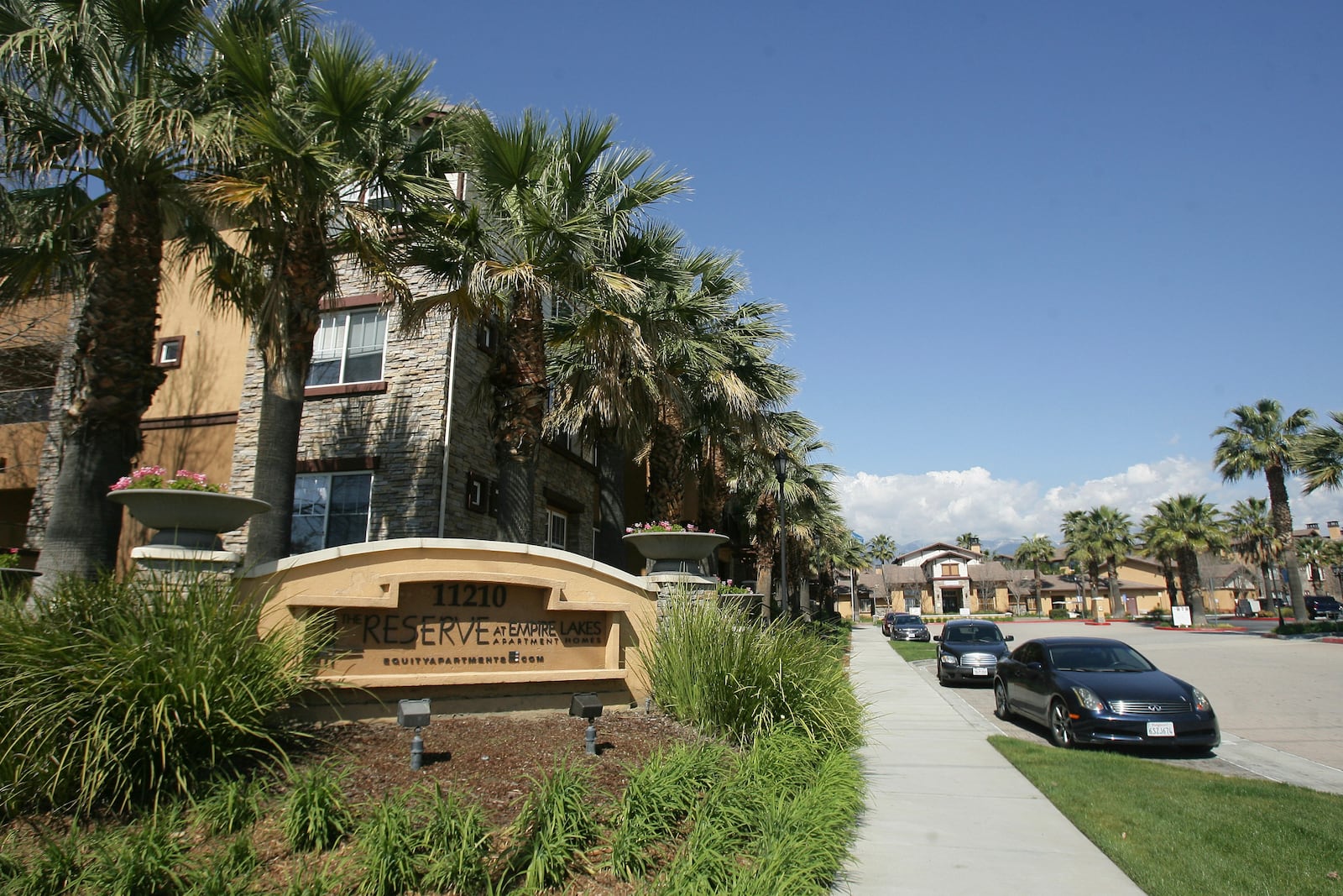 Federal agents raided about 20 locations, related to a birth tourism scheme, in three Southern California counties, including this apartment complex in Rancho Cucamonga, Calif., Tuesday, March 3, 2015. (Stan Lim/The Press-Enterprise via AP)