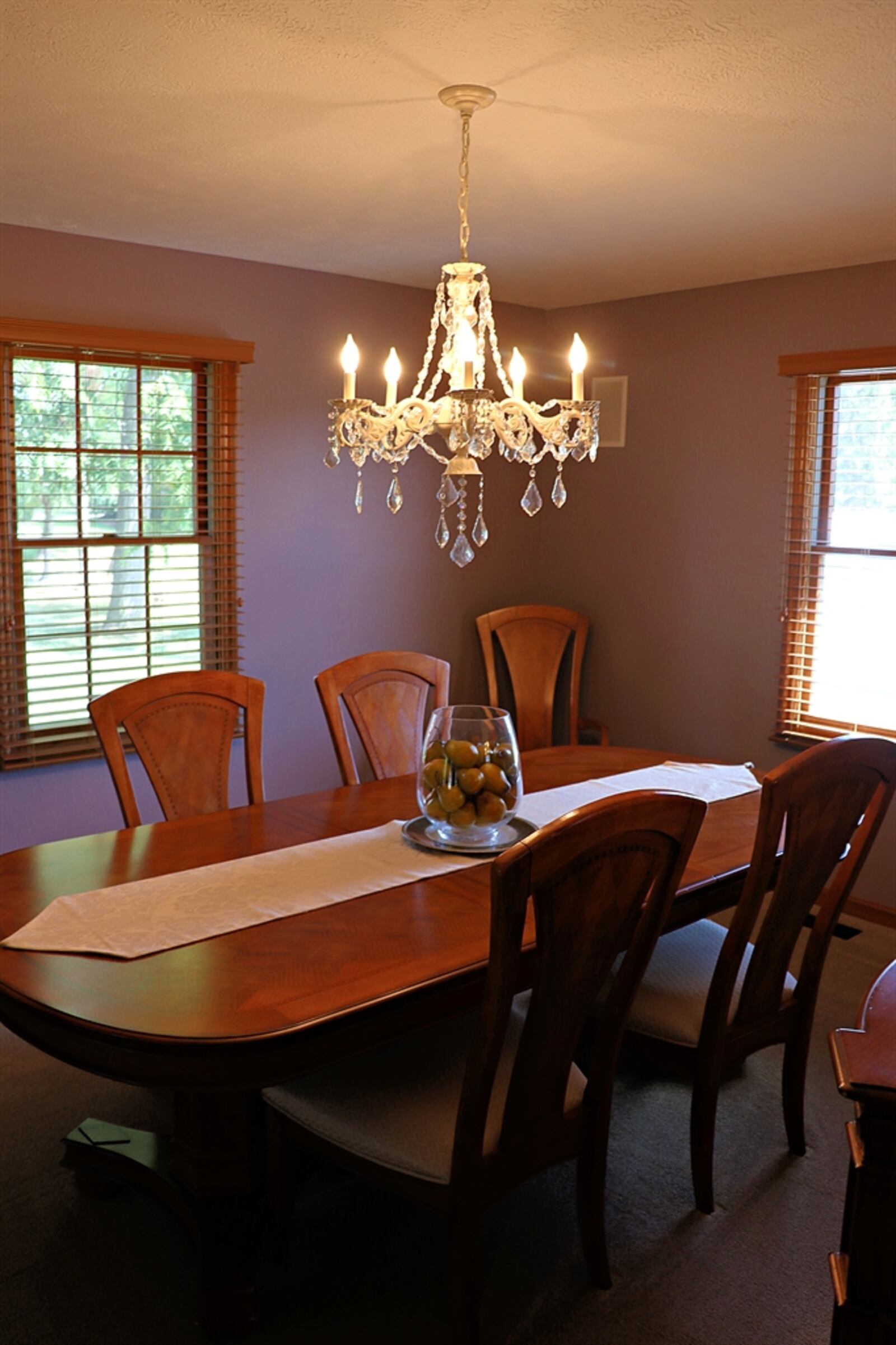 The dining room features a crystal chandelier. 