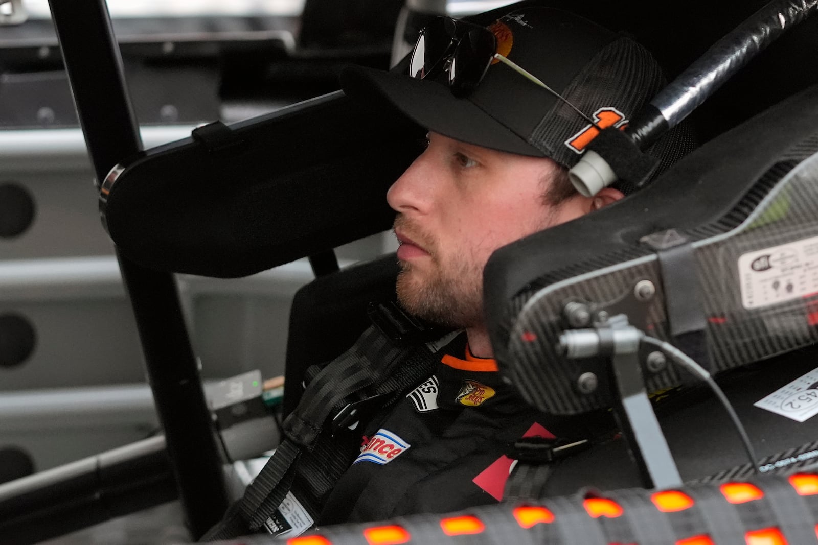 Chase Briscoe waits while his crew makes adjustments to his car during a practice session for the NASCAR Daytona 500 auto race at Daytona International Speedway, Friday, Feb. 14, 2025, in Daytona Beach, Fla. (AP Photo/John Raoux)