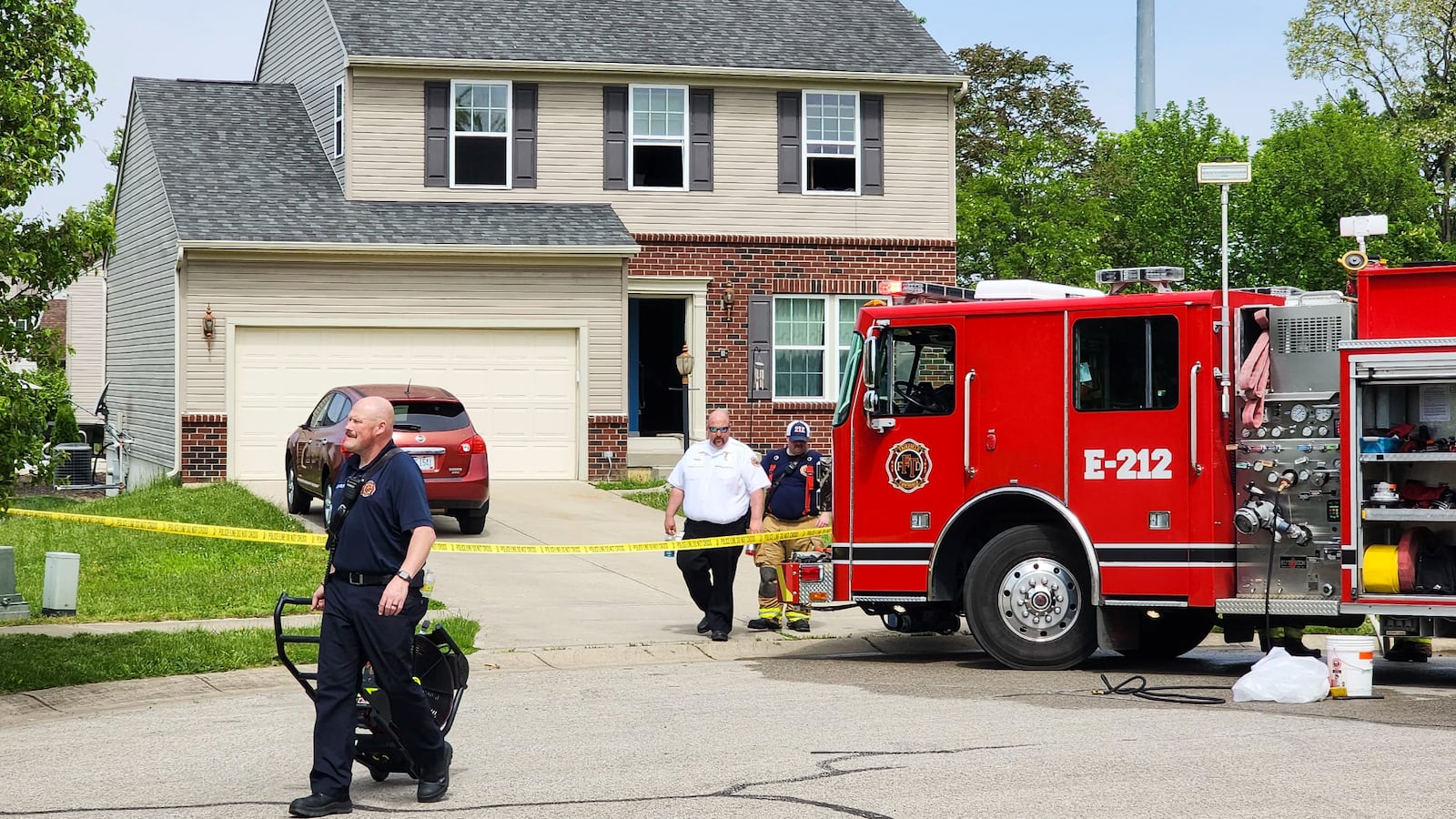 Fairfield Township police and fire crews along with Butler County fire investigation team and State Fire Investigators investigate a fire on Arroyo Ridge Court in Fairfield Township Thursday, May 11, 2023. A woman was transported by medical helicopter with burn injuries. NICK GRAHAM/STAFF