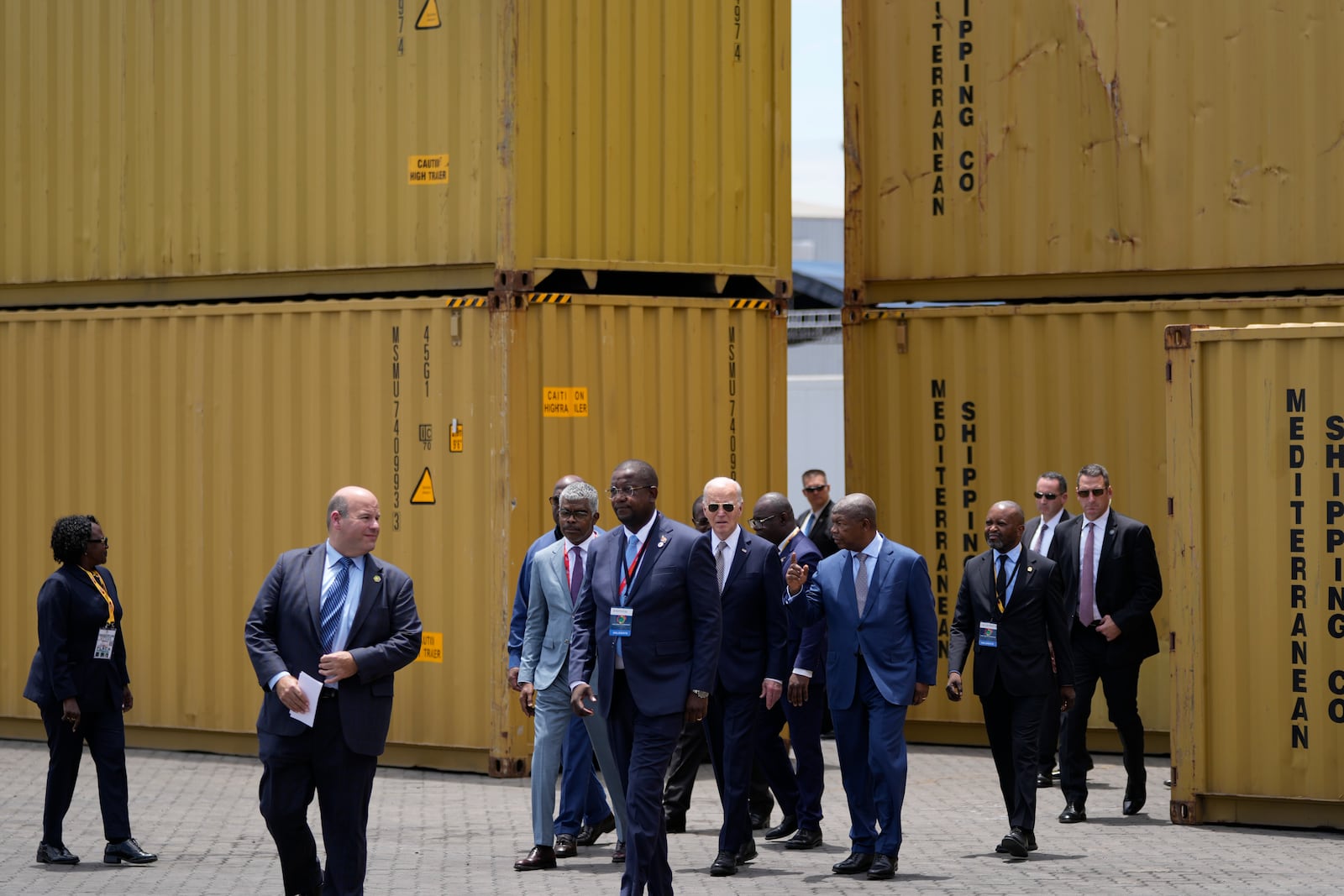 President Joe Biden, center, and Angola's President Joao Lourenco, right, tour the Lobito Port Terminal in Lobito, Angola, on Wednesday, Dec. 4, 2024. (AP Photo/Ben Curtis)