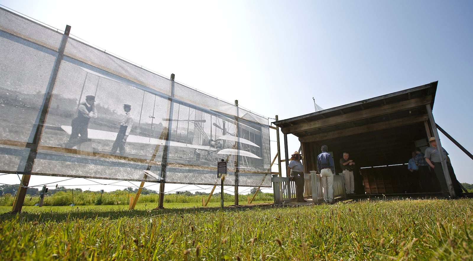 Dan Patterson, Artist in Residence with the Dayton Aviation Heritage National Historical Park in 2017 had a 1904 image of the Wright Brothers on Huffman Prairie printed on mesh for display on the site of the original photo.  The photo has since be removed after wind damaged the photo supporting structure twice.  TY GREENLEES / STAFF