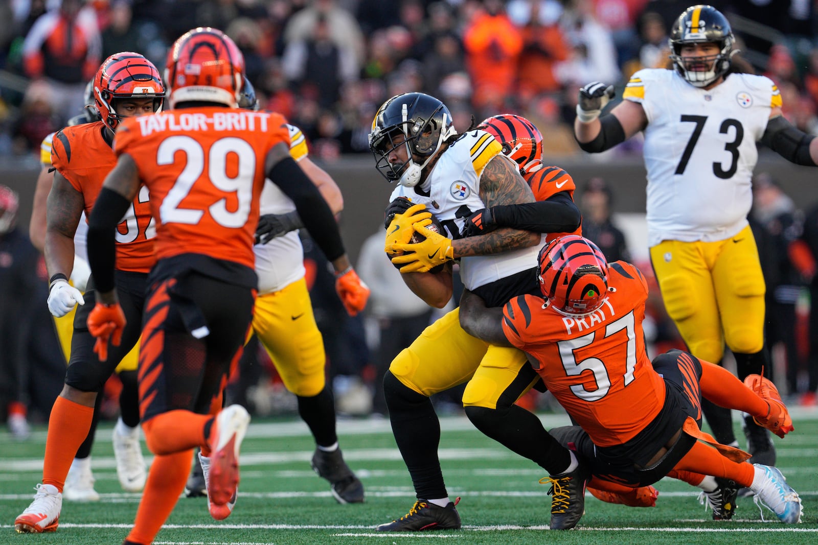 Pittsburgh Steelers tight end MyCole Pruitt is tackled by Cincinnati Bengals linebacker Germaine Pratt (57) during the second half of an NFL football game, Sunday, Dec. 1, 2024, in Cincinnati. (AP Photo/Jeff Dean)