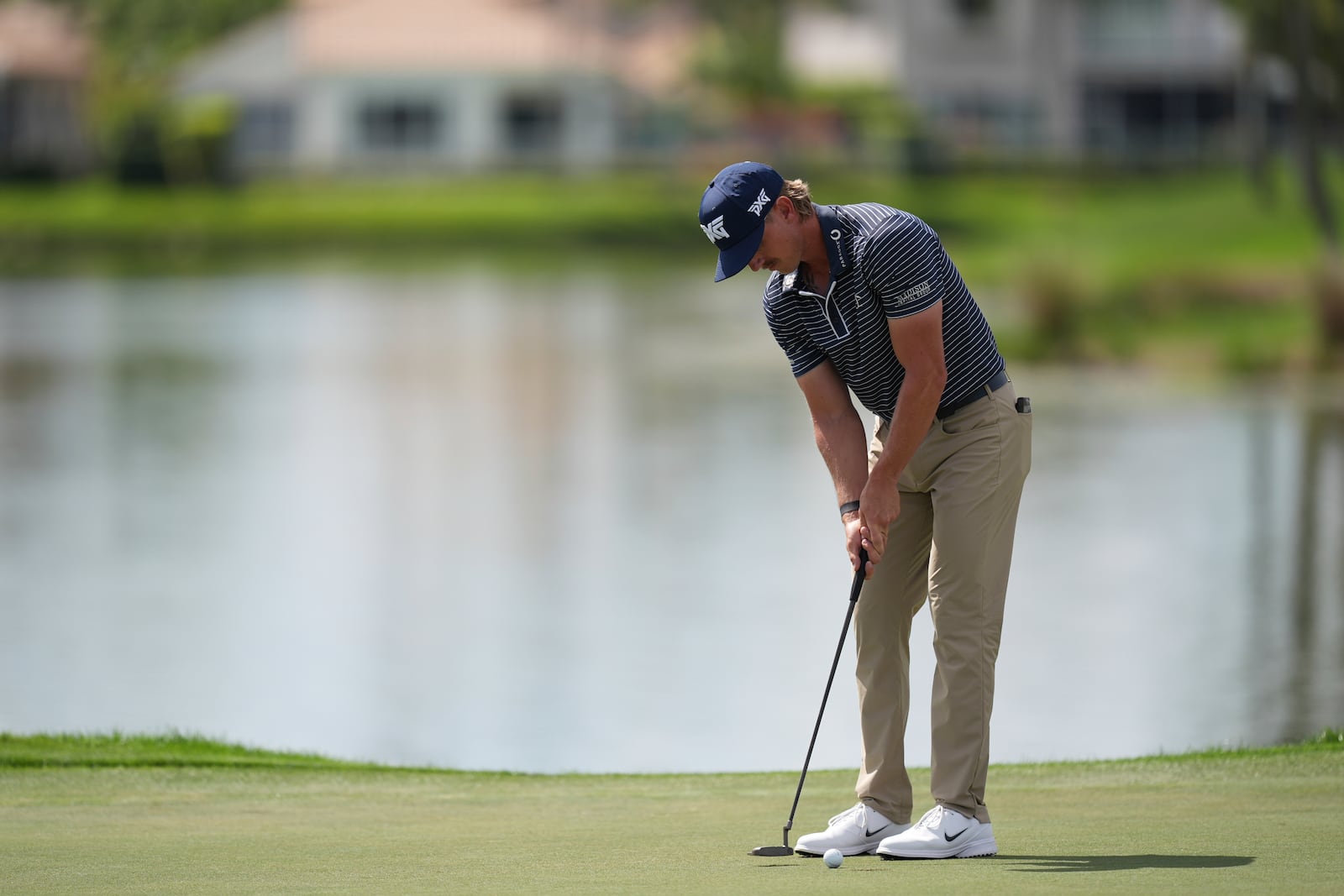 Jake Knapp putts on the 18th hole on his way to finishing with a 59 in his first round at the Cognizant Classic golf tournament, Thursday, Feb. 27, 2025, in Palm Beach Gardens, Fla. (AP Photo/Rebecca Blackwell)