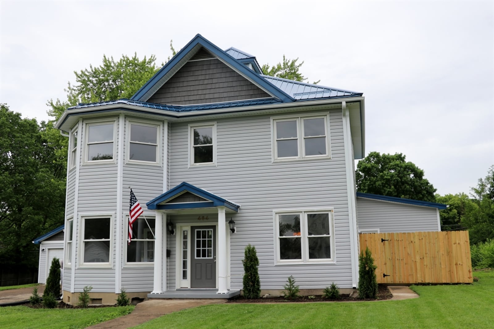 The half-acre property features a new traditional door unit with sidelights, and the impressive porch columns have been restored along with matching columns at the side entry. Contributed photo