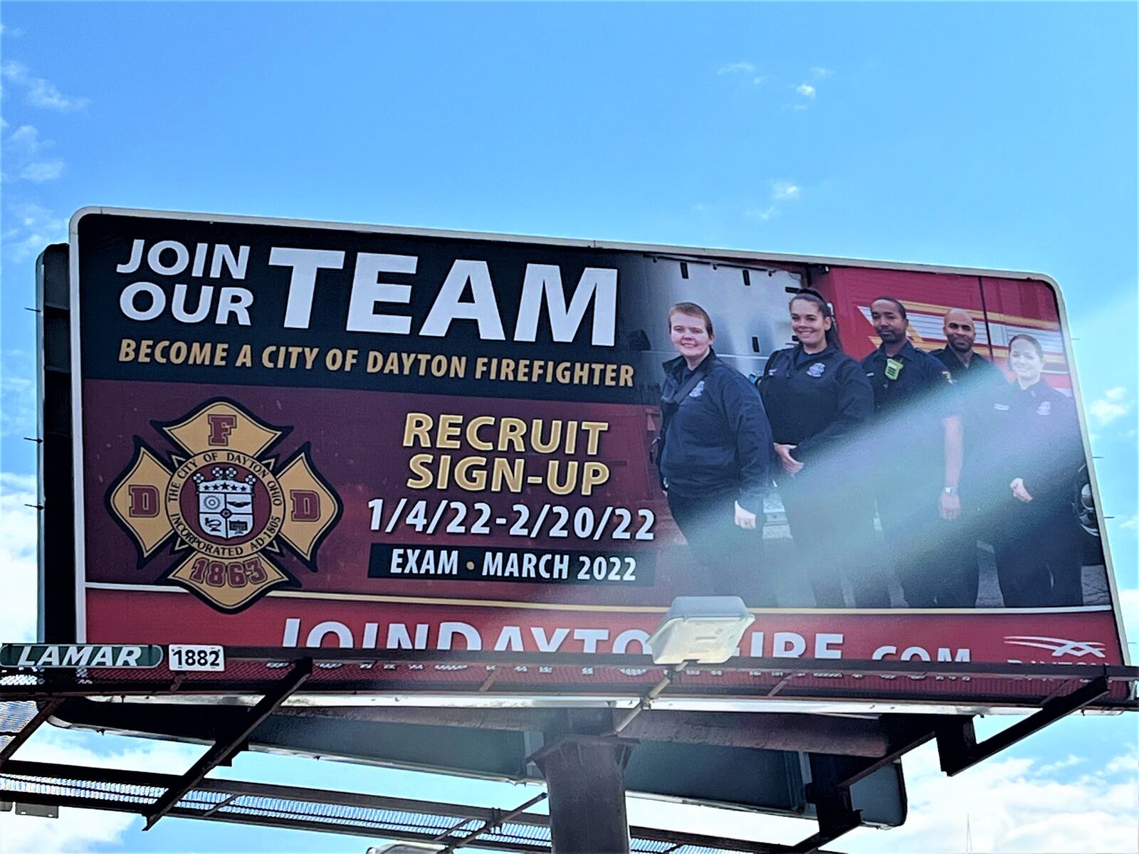 The Dayton Fire Department is seeking applications for fire recruits through Feb. 20. A billboard in West Dayton encourages people to join the team. CORNELIUS FROLIK / STAFF