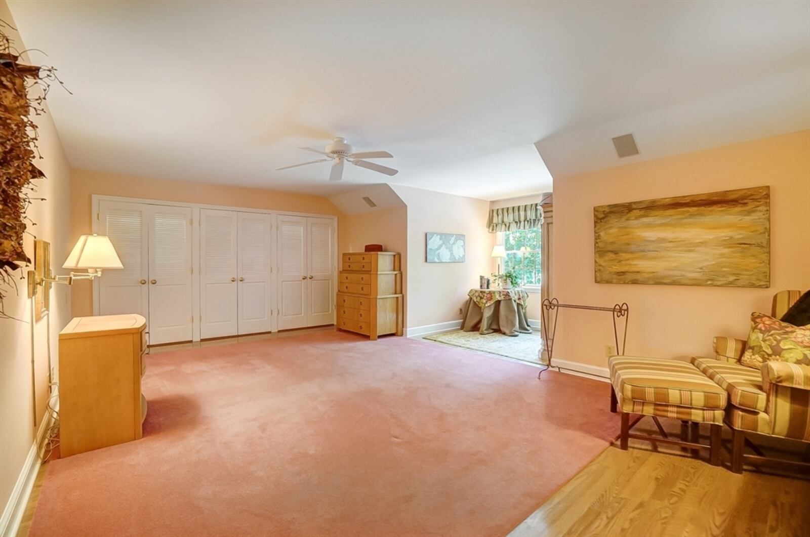 The primary bedroom includes a wall of closets and bay sitting area. CONTRIBUTED