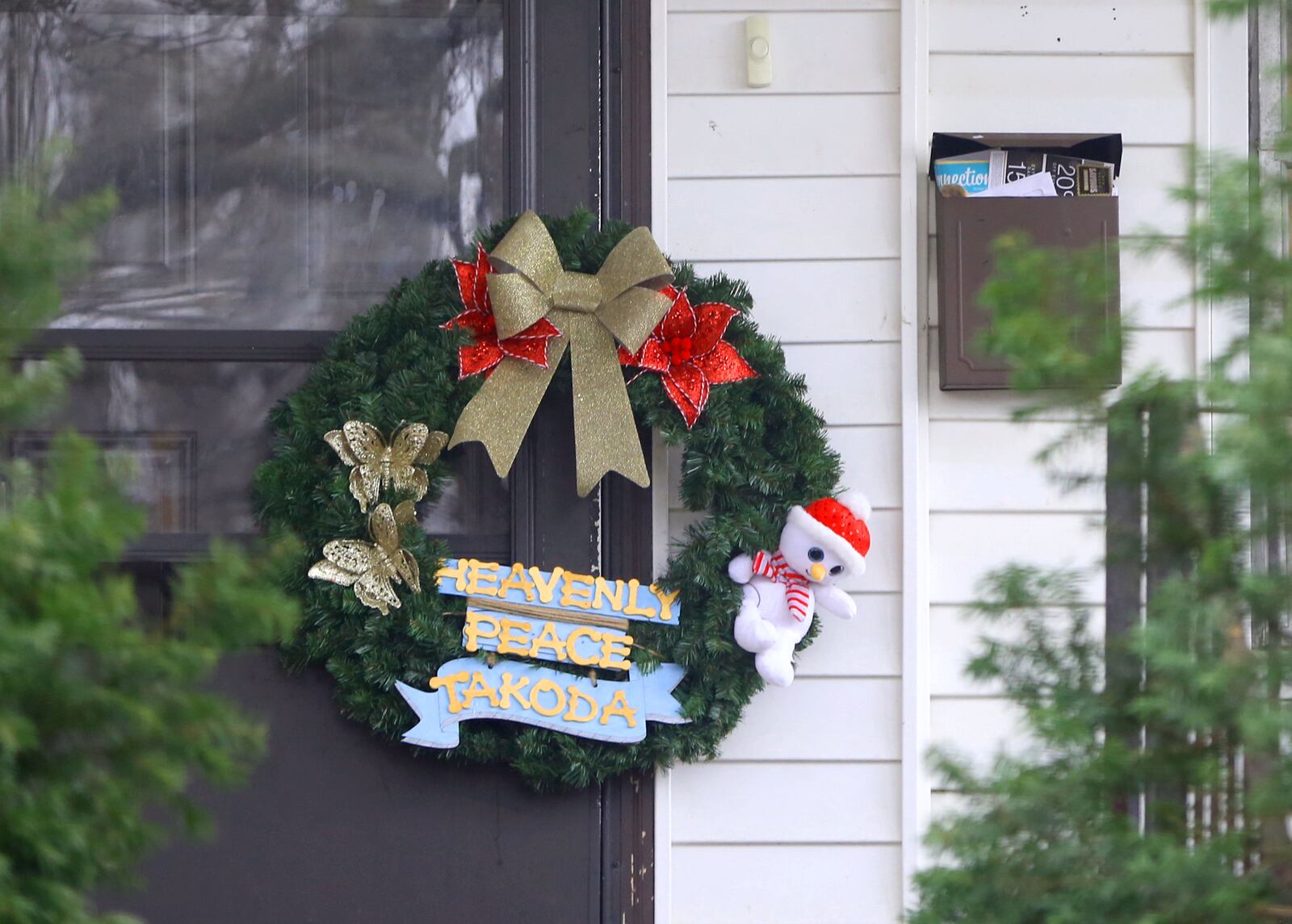 A wreath has been left on the front door of 1934 Kensington Drive in Dayton. Takoda Collins, 10, was rushed to Dayton's Children's Hospital on Dec. 13 and was pronounced dead after his father Al-Mutahan McLean called police to say he found the boy unresponsive in their Kensington Drive home. McLean, 30, faces charges in Montgomery County Common Pleas Court in connection to what law enforcement described in court records as "extreme" child abuse against Takoda. LISA POWELL / STAFF