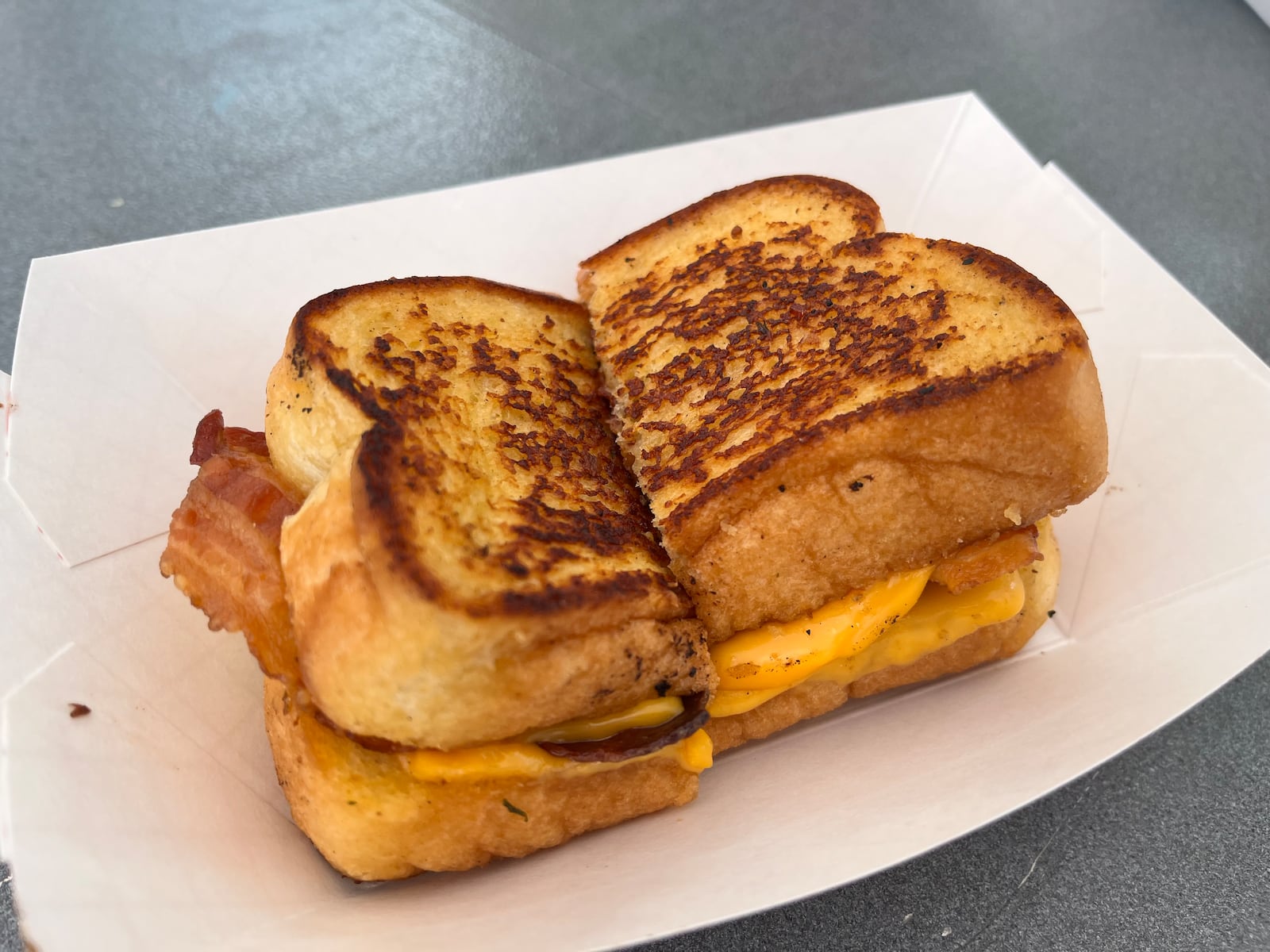 Just over a dozen food trucks on Saturday, Aug. 3, 2024 put their spin on what it means to have bacon at the forefront during Bacon Fest at the Fraze Pavilion in Kettering. NATALIE JONES/STAFF