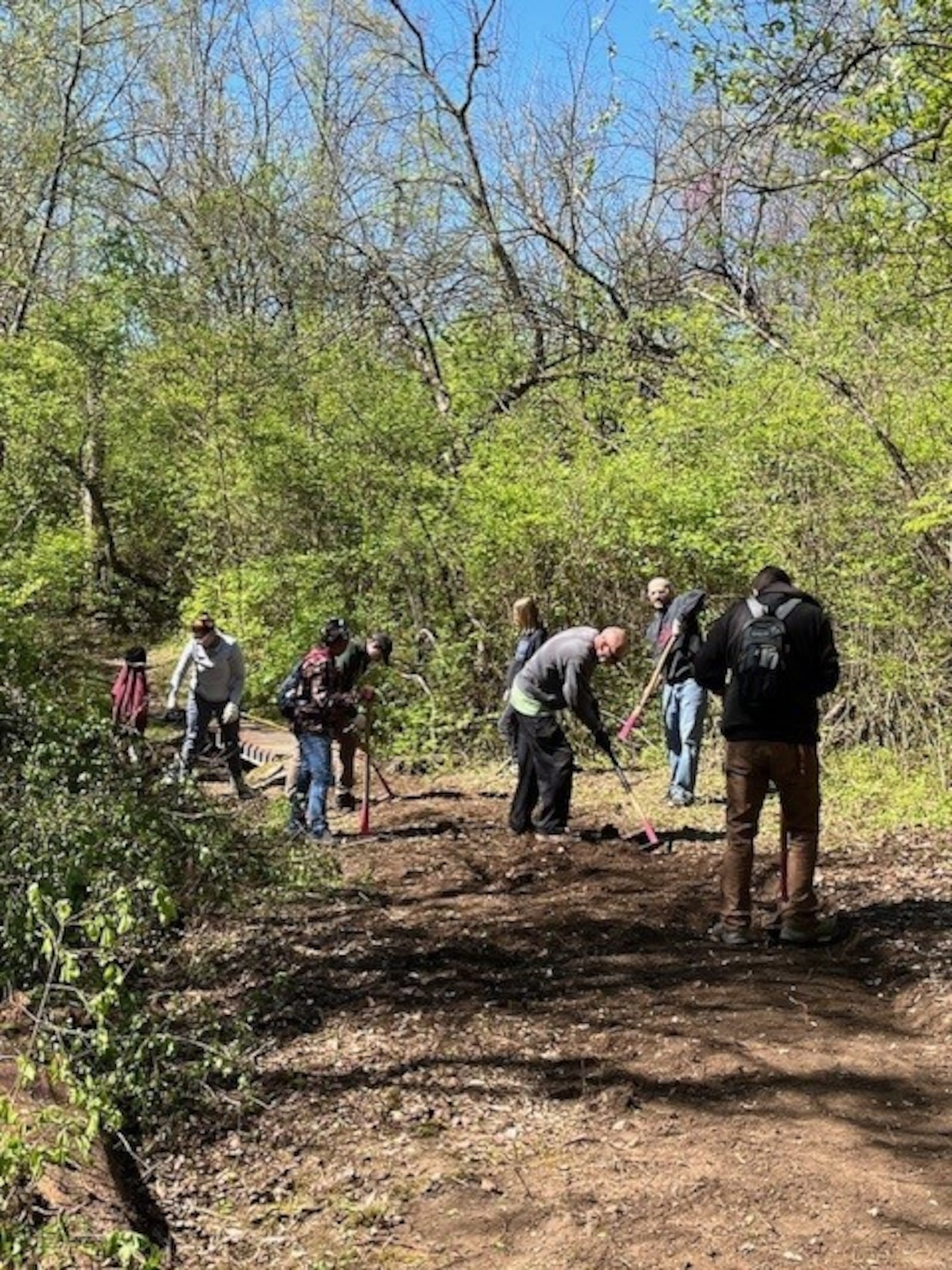 Five Rivers MetroParks volunteers work on trail maintenance at the MetroParks Mountain Biking Area (MoMBA). CONTRIBUTED