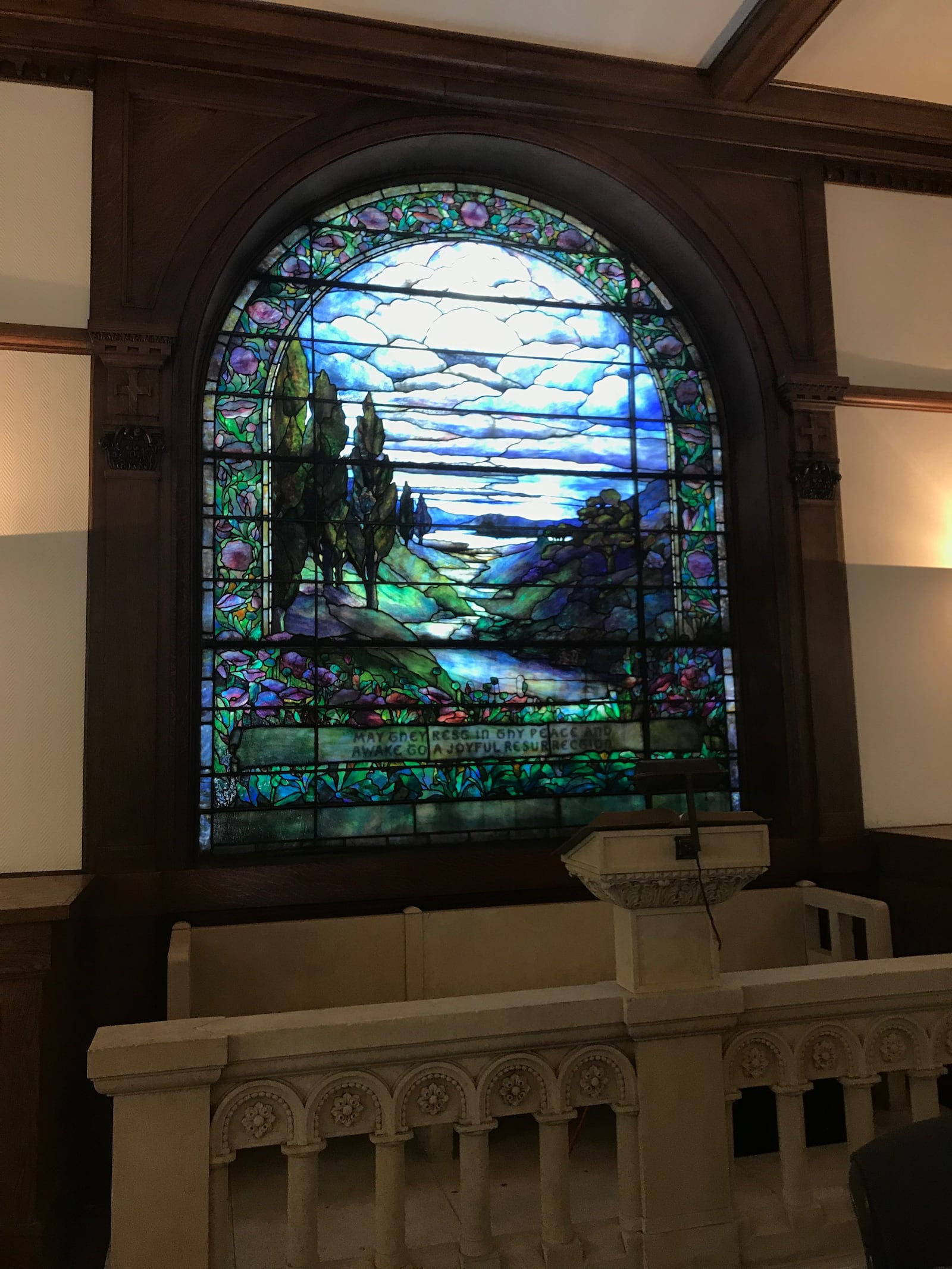 The window mosaic inside Woodland Cemetery's chapel is a genuine Tiffany-built window. Meaning, layers and layers of glass make up each section of color.