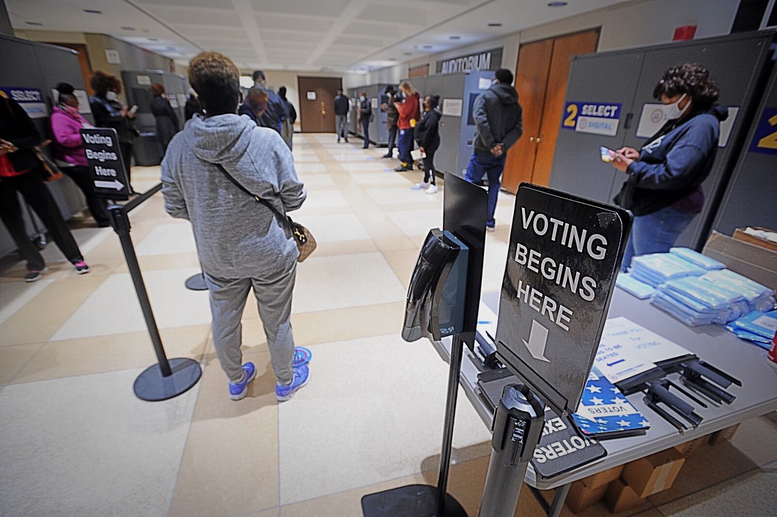 Long lines greeted voters at the Montgomery County Board of Elections on Tuesday, Oct. 6, 2020, as early voting began for the November general election. Early in-person voting in the state lasts until Nov. 2 and absentee ballots can be dropped off at the board office until Election Day, which is Nov. 3. In Montgomery County, registered voters can cast their ballot at the board of elections located at 451 W. Third St. in Dayton. MARSHALL GORBY/STAFF