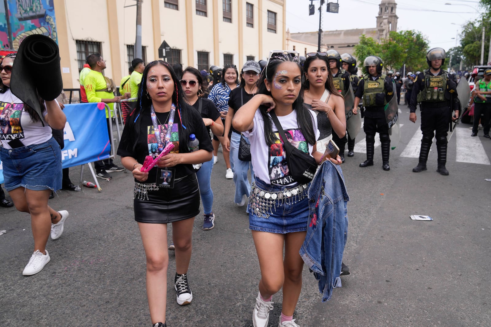 Fans of Colombian pop star Shakira leave the National Stadium upon learning she canceled her concert after being hospitalized, in Lima, Peru, Sunday, Feb. 16, 2025. (AP Photo/Martin Mejia)