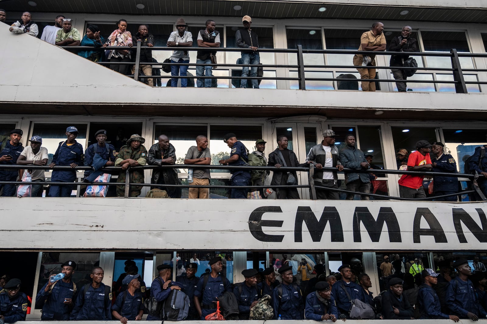 Former members of the Armed Forces of the Democratic Republic of Congo (FARDC) and police officers who allegedly surrendered to M23 rebels arrive in Goma, Congo, Sunday, Feb. 23, 2025. (AP Photo/Moses Sawasawa)