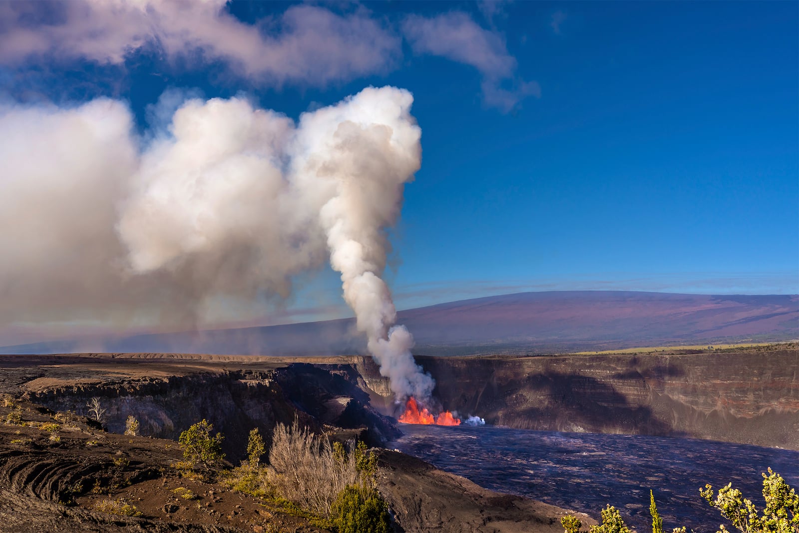 In this photo provided by the National Park Service, an eruption takes place on the summit of the Kilauea volcano in Hawaii, Monday, Dec. 23, 2024. (Janice Wei/NPS via AP)