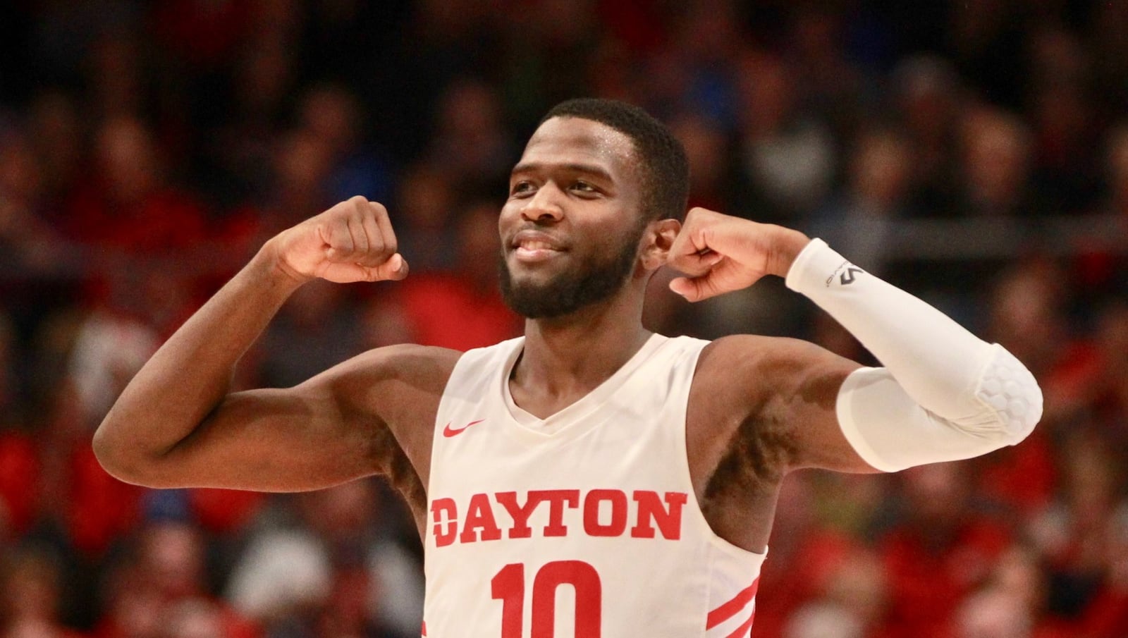 Dayton’s Jalen Crutcher flexes after a basket against Omaha on Tuesday, Nov. 19, 2019, at UD Arena. David Jablonski/Staff