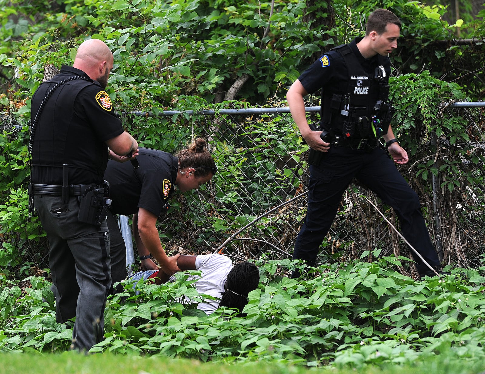 Montgomery County sheriff's deputies and Dayton police held a juvenile at gun point after he was seen running through a neighborhood near North Dixie Drive with a handgun Monday morning June 19, 2023. The juvenile was apprehended hiding in a garden behind a house on Ridge Road. MARSHALL GORBY\STAFF