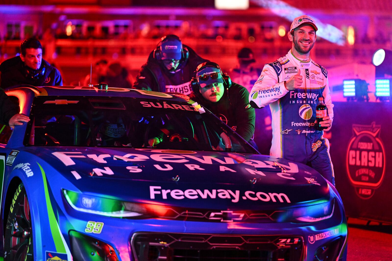 Daniel Suarez, right, and his pit crew are introduced prior to a NASCAR Cup Series auto race at Bowman Gray Stadium, Sunday, Feb. 2, 2025, in Winston-Salem, N.C. (AP Photo/Matt Kelley)