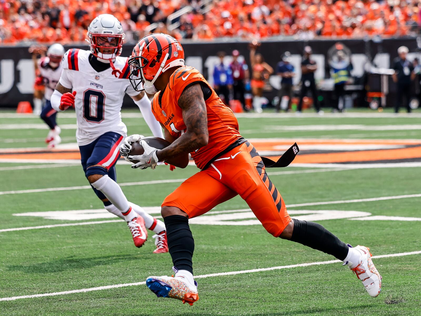 Bengals wide receiver Ja'Marr Chase runs runs after a catch during their 16-10 loss to New England Patriots Sunday, Sept. 8, 2024 at Paycor Stadium in Cincinnati. NICK GRAHAM/STAFF