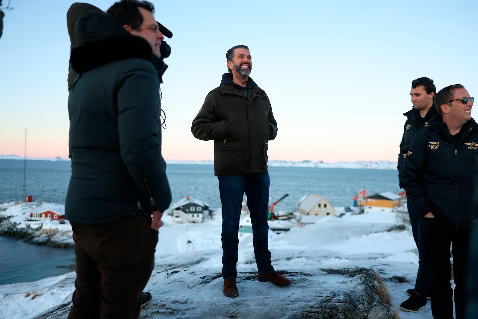 FILE - Donald Trump Jr., center, smiles after arriving in Nuuk, Greenland, Tuesday, Jan. 7, 2025. (Emil Stach/Ritzau Scanpix via AP, File)