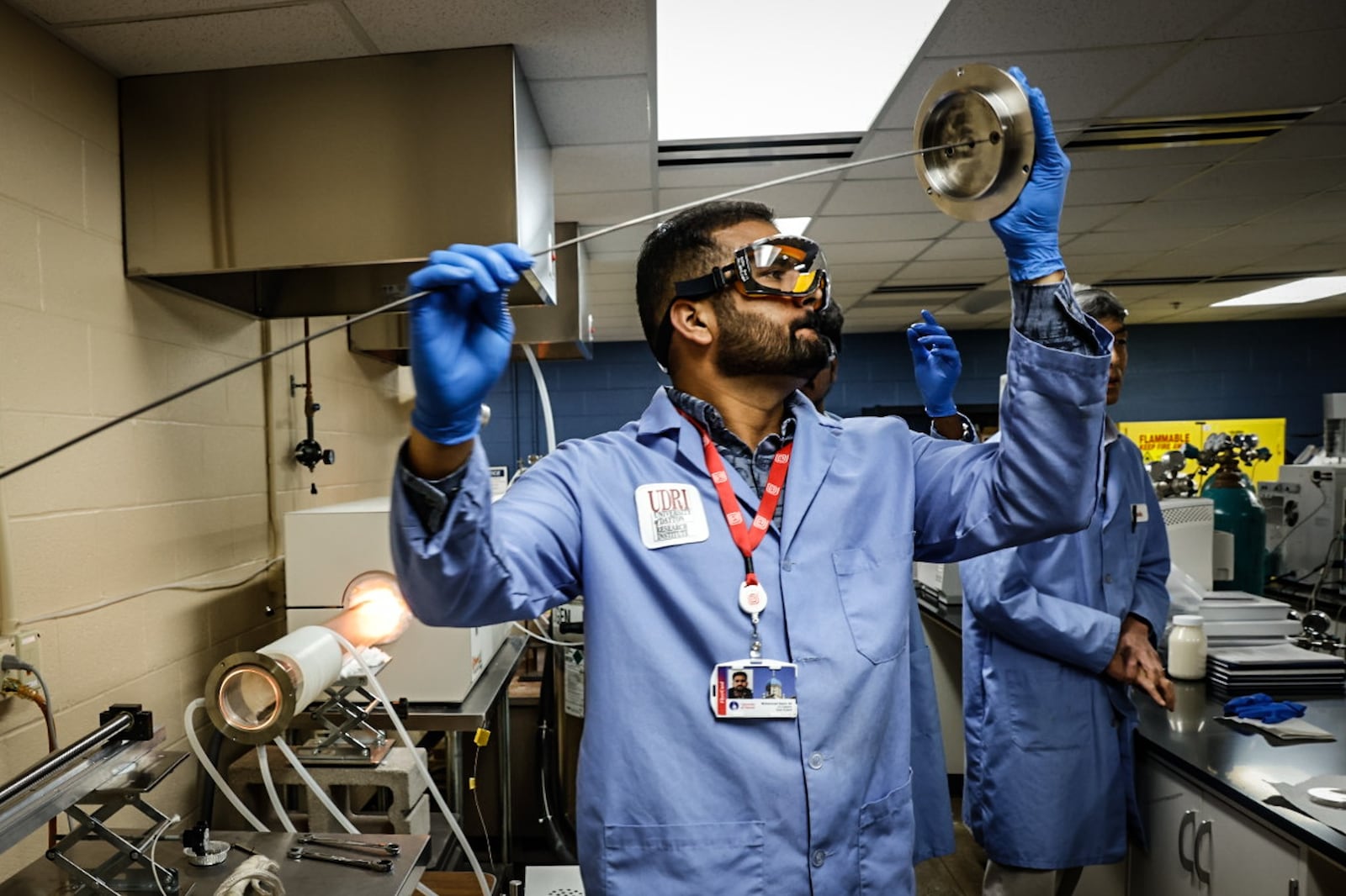 University of Dayton chemical engineering grad student, Muhammad Qasim Ali prepares the PFAS incinerator at the research Insititute. Students and faculty are working on way to eliminate PFAS from the environment. JIM NOELKER/STAFF