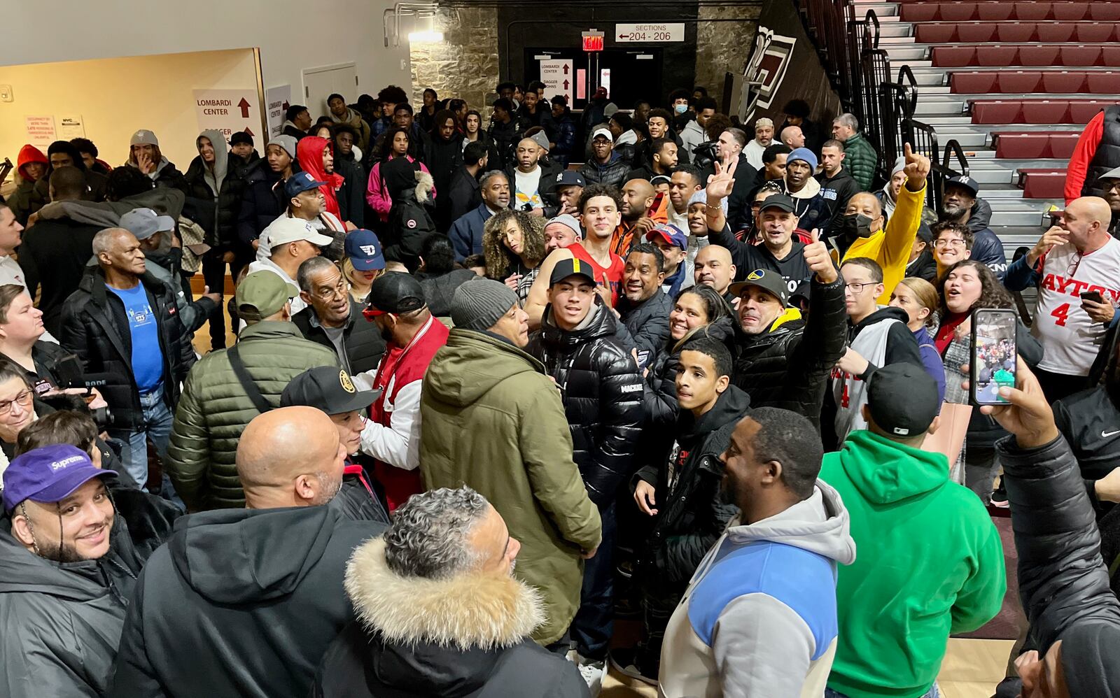 Dayton's Koby Brea is surrounded by fans from his hometown after a victory against Fordham on Tuesday, Jan. 10, 2023, at Rose Hill Gym in Bronx, N.Y. David Jablonski/Staff