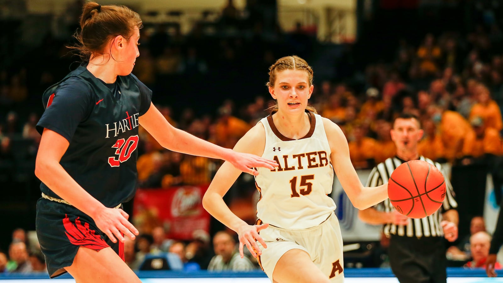 Alter High School sophomore Riley Smith drives past Bishop Hartley junior Ella Brandewie during their game on Thursday night at UD Arena. CONTRIBUTED PHOTO BY MICHAEL COOPER