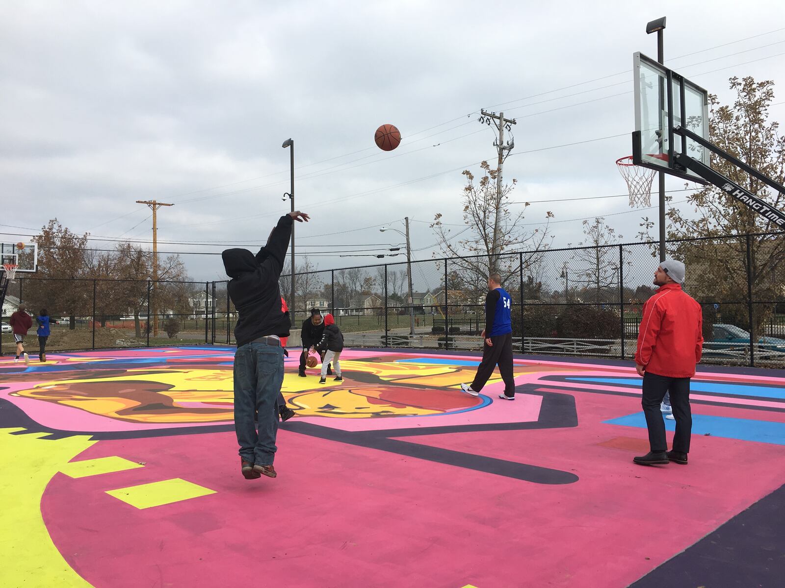 Kids shoot hoops during a ribbon cutting event in late 2019 for the Project Rebound court restoration at the Greater Dayton Recreation Center. Project Rebound was one of the three winning projects at the 2017 UpDayton Summit.