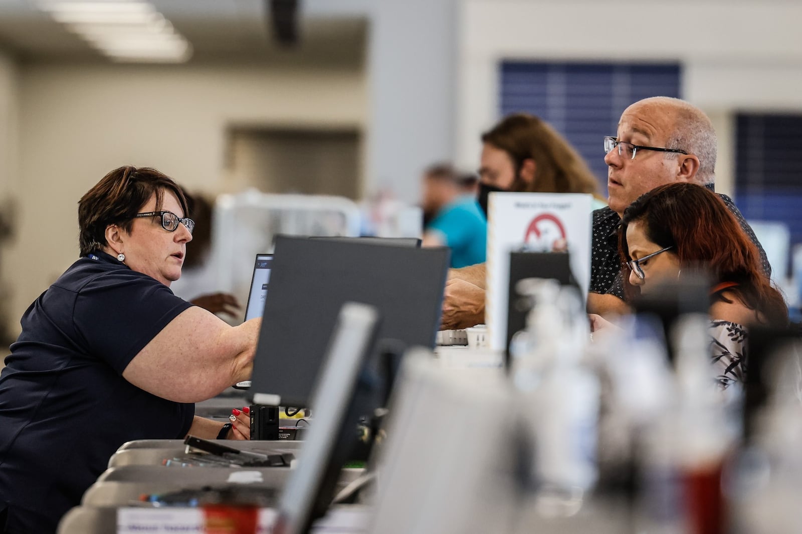 Flyers at the Dayton International Airport check in at the Delta Airline ticket counter before traveling Friday July 15, 2022.
 JIM NOELKER/STAFF