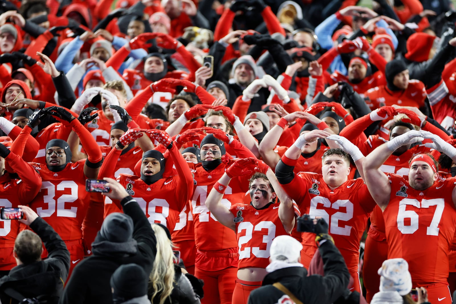 Ohio State players celebrate after their win over Tennessee during the first round of the College Football Playoff, Saturday, Dec. 21, 2024, in Columbus, Ohio. (AP Photo/Jay LaPrete)