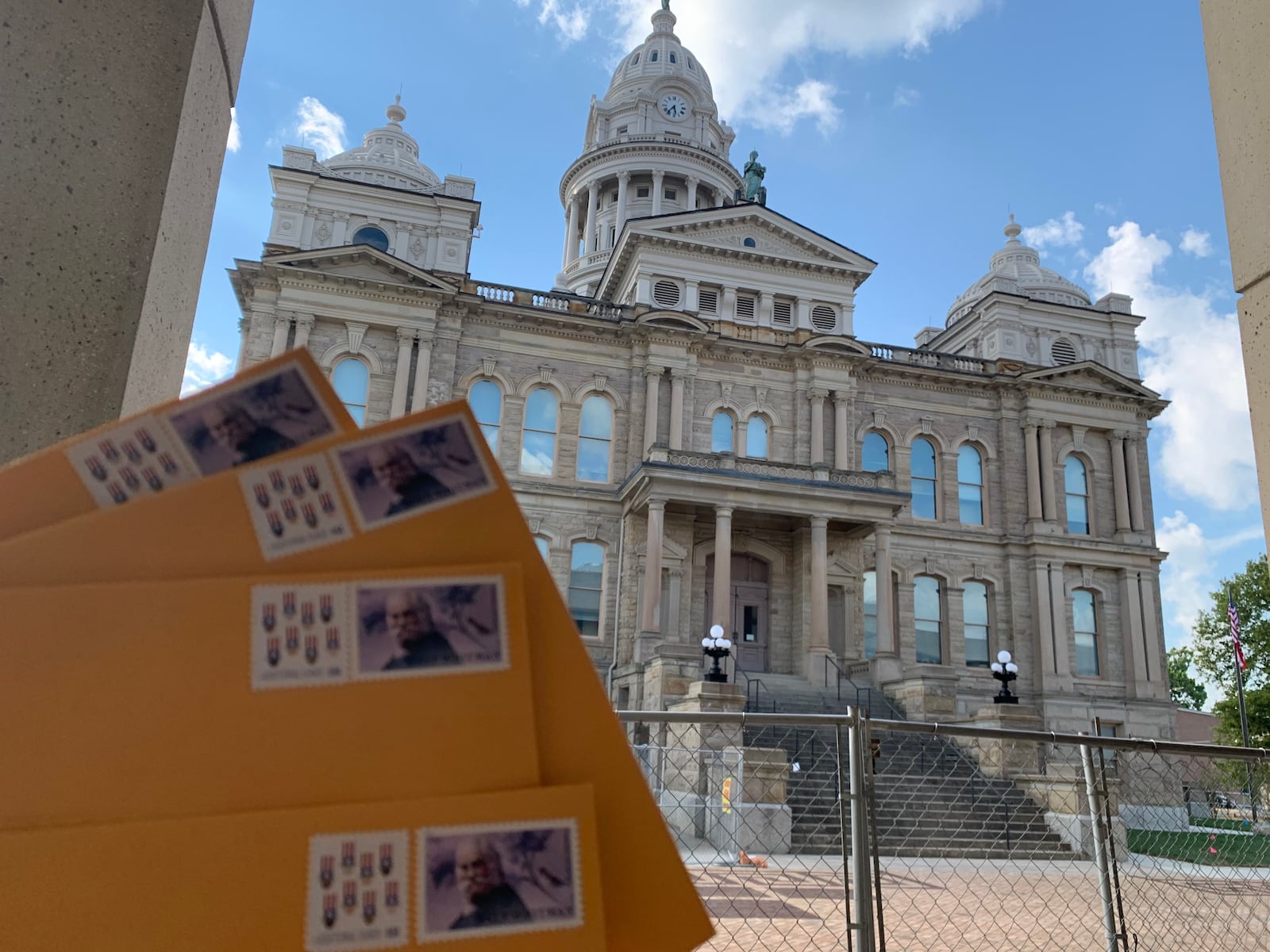 A Dayton Daily News reporter dropped envelopes roughly the same size and shape as ballots into a mailbox near the Miami County courthouse as part of a test of the U.S.  Postal Service.