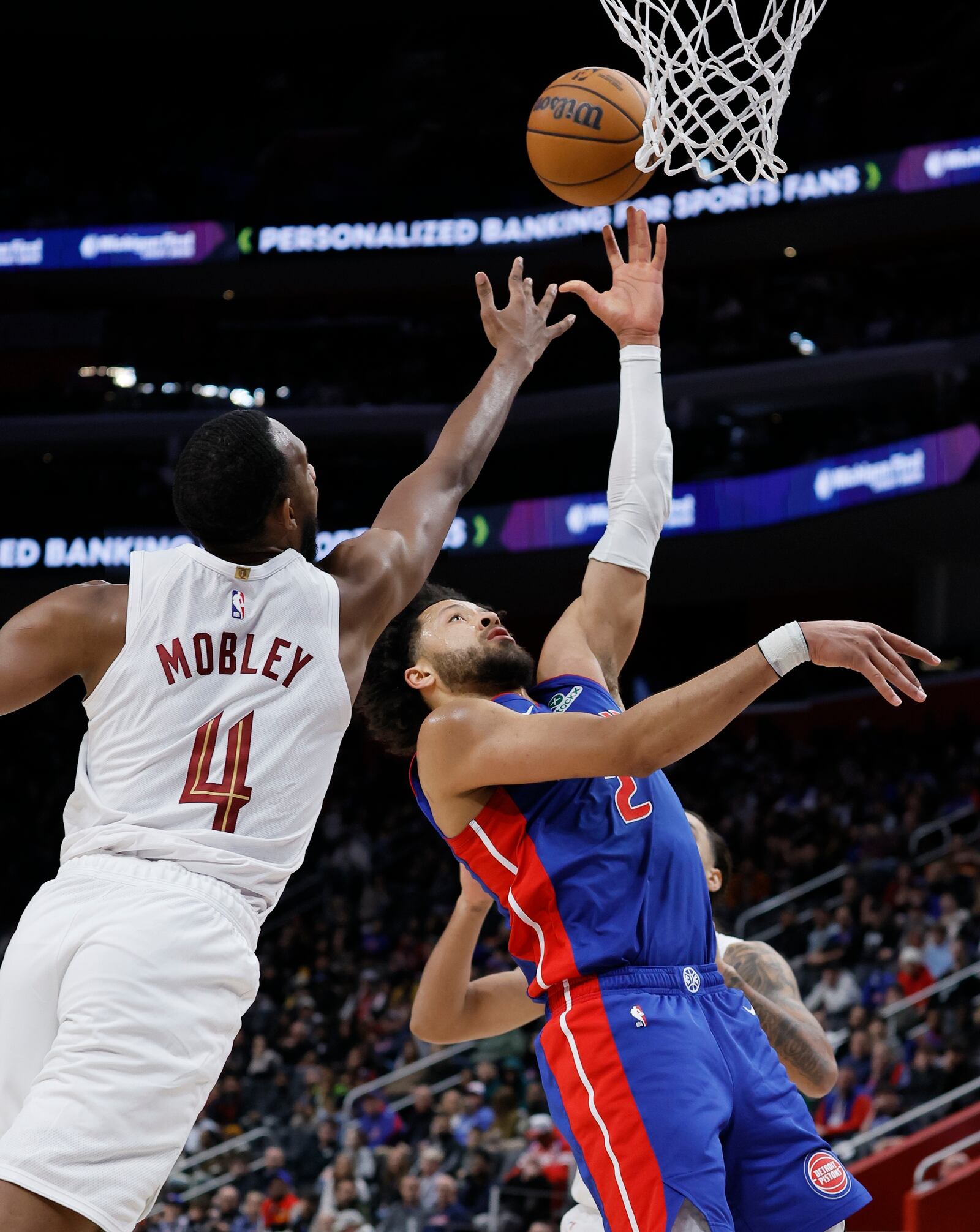 Detroit Pistons guard Cade Cunningham (2) goes to the basket against Cleveland Cavaliers forward Evan Mobley (4) during the first half of an NBA basketball game Wednesday, Feb. 5, 2025, in Detroit. (AP Photo/Duane Burleson)