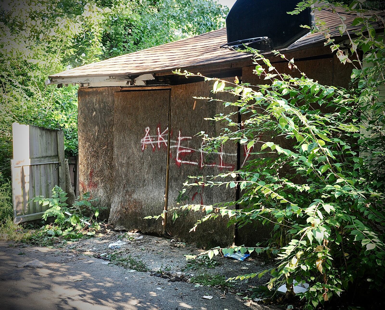 A badly decomposing body found under debris in the detached garage of a Burkhardt Avenue house on Thursday, Aug. 18, 2022, was later identified as 44-year-old CJ Pierce of Dayton, who was reported missing in July. MARSHALL GORBY / STAFF