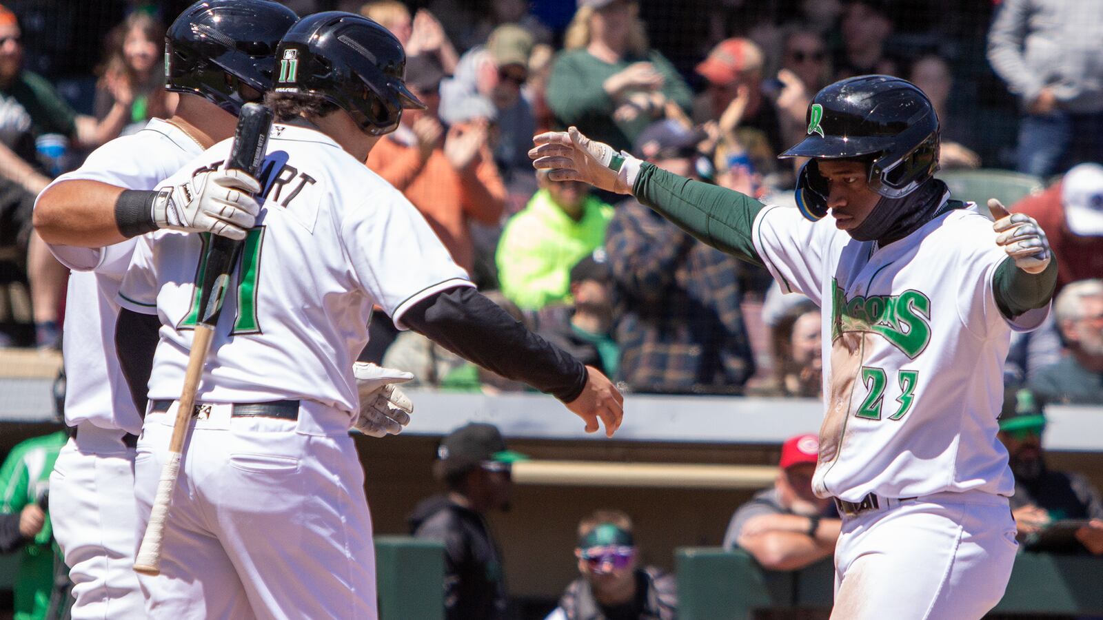 Cam Collier is greeted at home by teammates after a home run during a game earlier this season. Jeff Gilbert/CONTRIBUTED