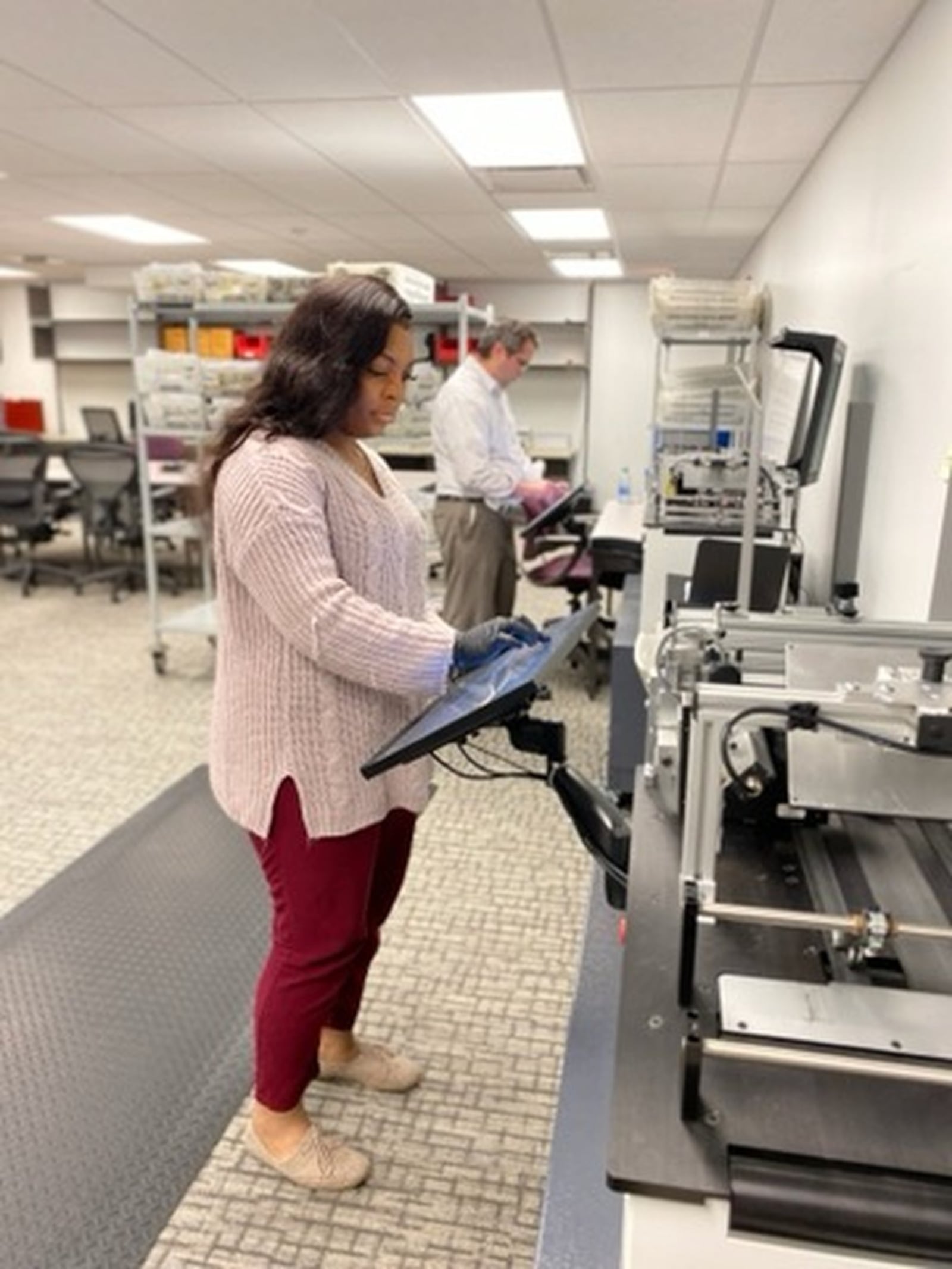 Montgomery County Board of Elections temporary employees Imani Cunningham and Mike Miller are scanning identification envelopes of voted ballots on the board’s new mail ballot verifiers. Staff are processing applications for absentee ballots and scanning the ballots that are received as Ohio has switched to mail-in voting after the state canceled in-person voting for the March 17 primary election due to the coronavirus crisis. The absentee ballots will be tabulated on April 28.