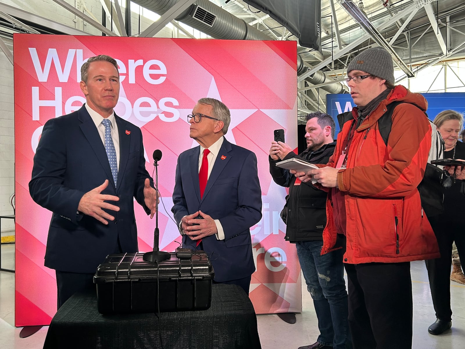 Ohio Gov. Mike DeWine watches Lt. Gov. Jon Husted answer questions at a press gaggle on Thursday Jan.16 following a presentation of Anduril Industries' plans to build a 500-acre weapons manufacturing site in Pickaway County.