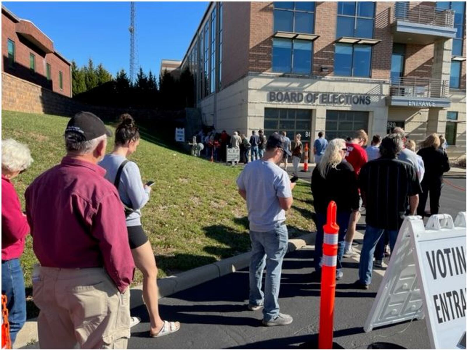 Warren County residents enjoyed a beautiful and sunny fall day as they stood in line waiting to cast an early vote at the Warren County Board of Elections. ED RICHTER/STAFF