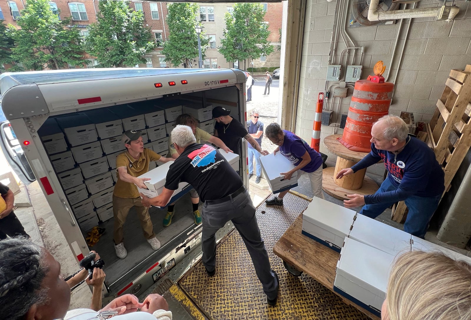 FILE - Volunteers with Citizens Not Politicians deliver petitions from citizens around the state of Ohio at Secretary of State Frank LaRose's office on Monday, July 1, 2024, in Columbus, Ohio. (AP Photo/Patrick Orsagos, File)