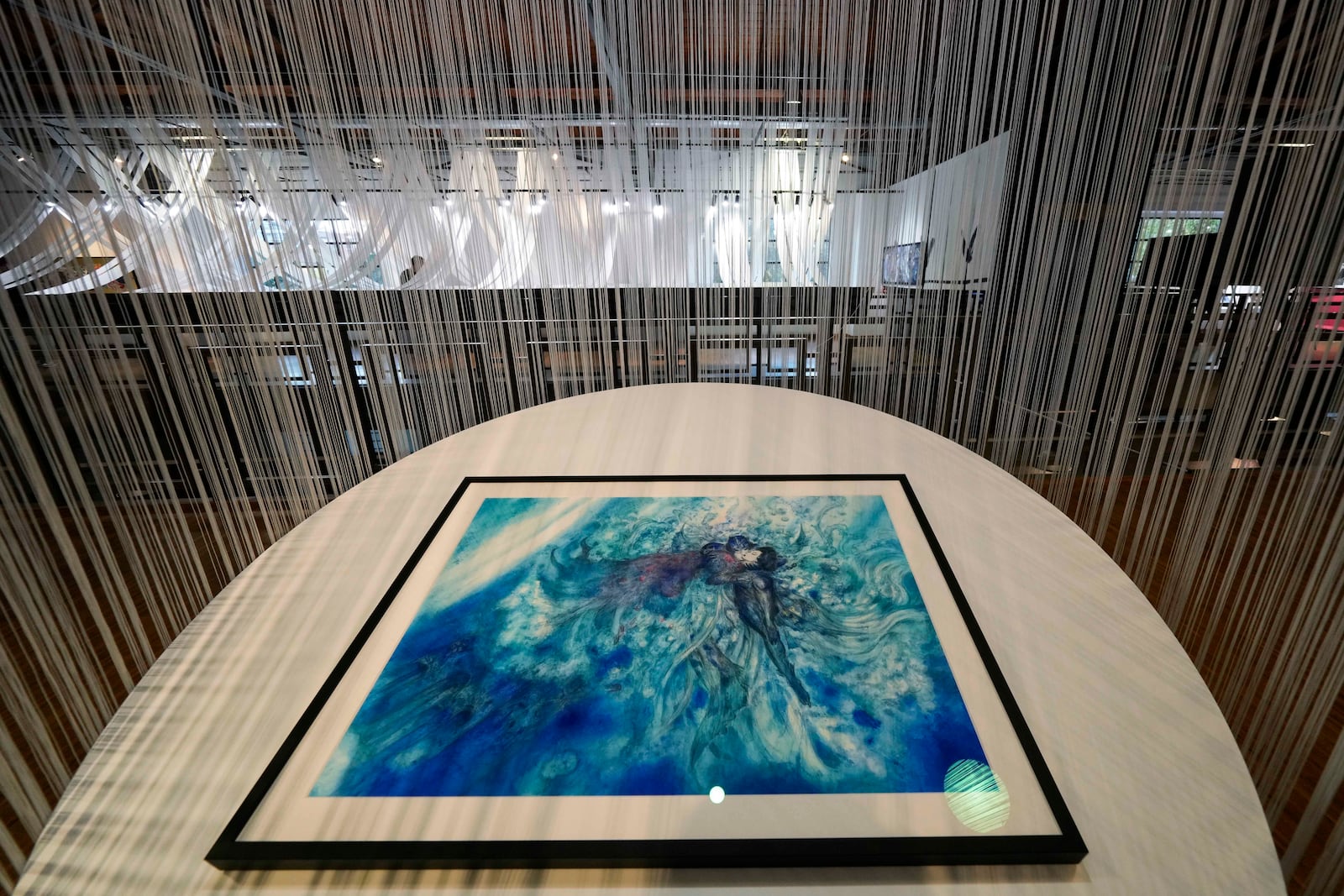 Creations of artist Yoshitaka Amano are displayed during the press preview of the exhibition "Amano Corpus Animae", celebrating his 50-year-long career, at the Fabbrica del Vapore, in Milan, Italy, Tuesday, Nov. 12, 2024. (AP Photo/Luca Bruno)