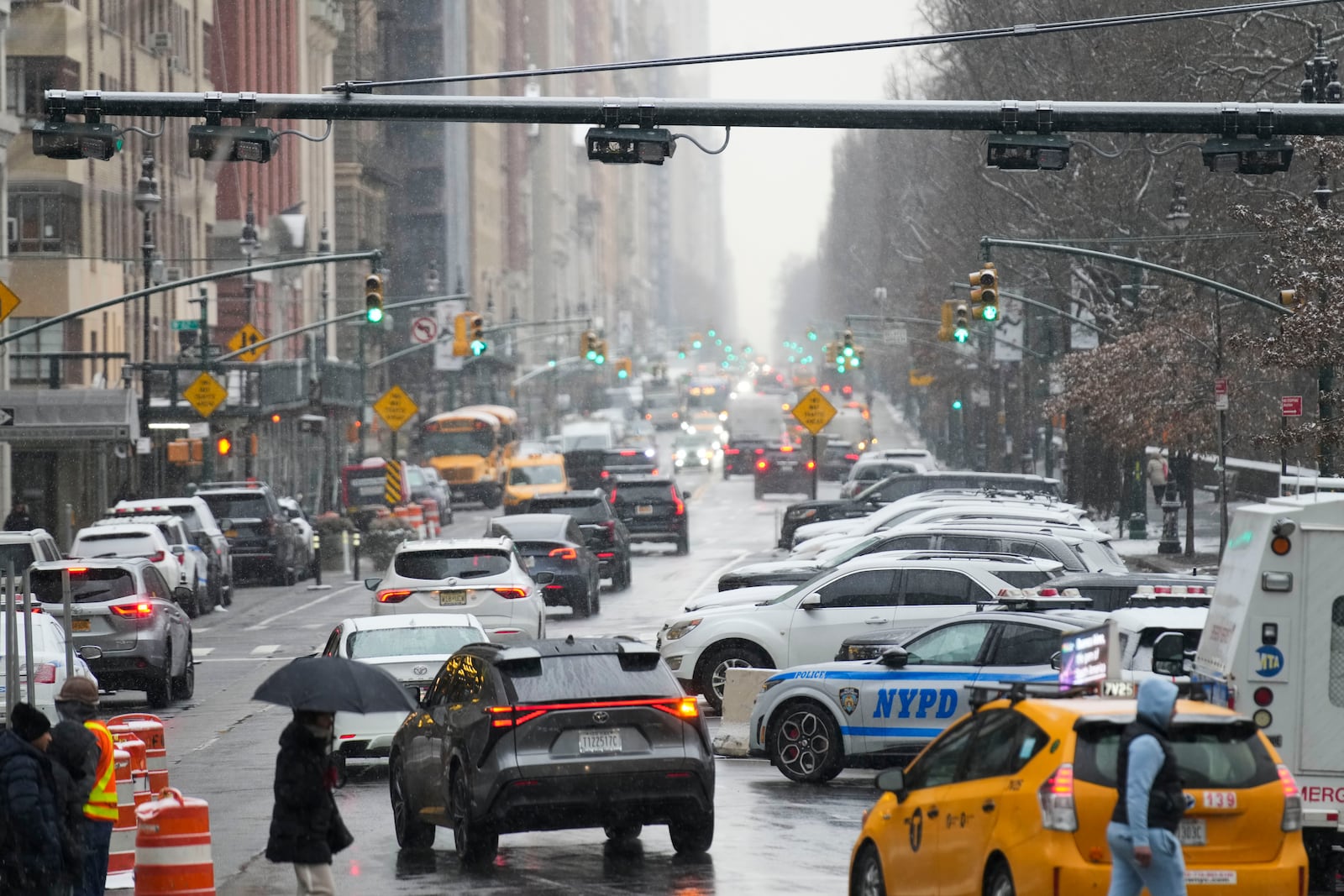 FILE - Devices used for congestion tolling hang above traffic on a Manhattan street in New York, Monday, Jan. 6, 2025. (AP Photo/Seth Wenig, File)