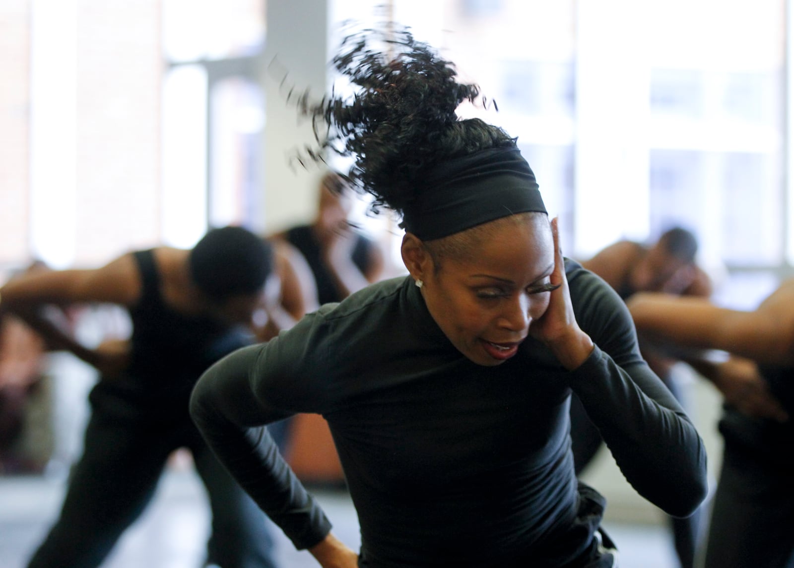 Sheri "Sparkle" Williams performs with The Dayton Contemporary Dance Company Thursday at the University of Dayton as part of UD's artist-in-residence program. DCDC will hold the world premiere of "Traces" Feb. 23 at the Dayton Masonic Temple. They will be joined by the Stivers School For the Arts Dance Ensemble. STAFF PHOTO BY LISA POWELL