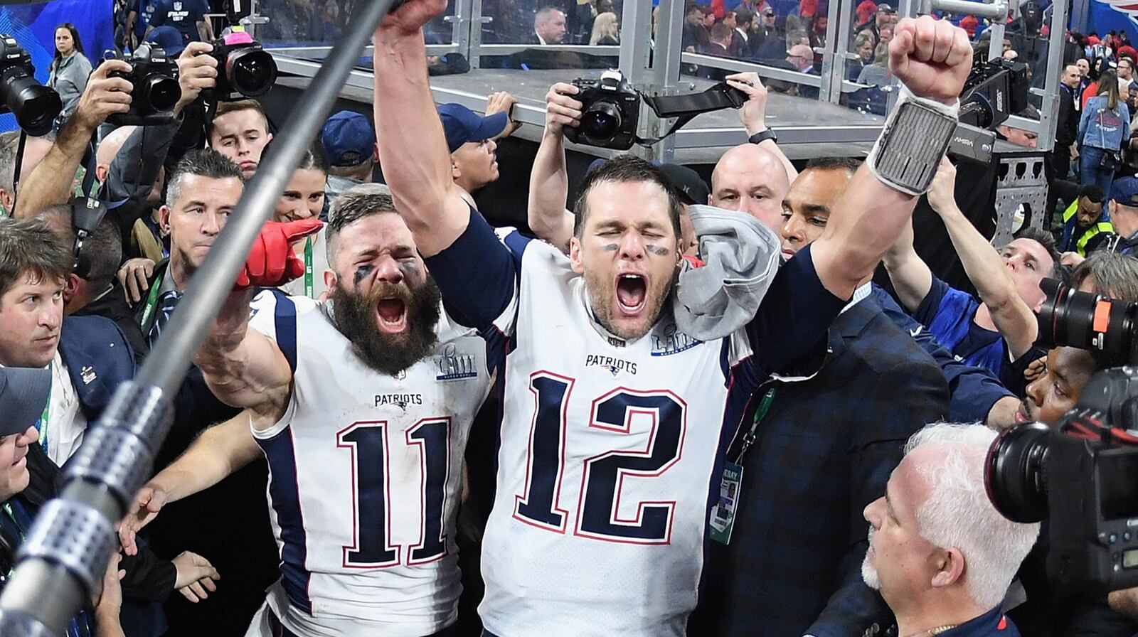 Julian Edelman #11 of the New England Patriots and teammate Tom Brady #12 celebrate at the end of the Super Bowl LIII in Atlanta. The game is the lowest for a Super Bowl in more than a decade.