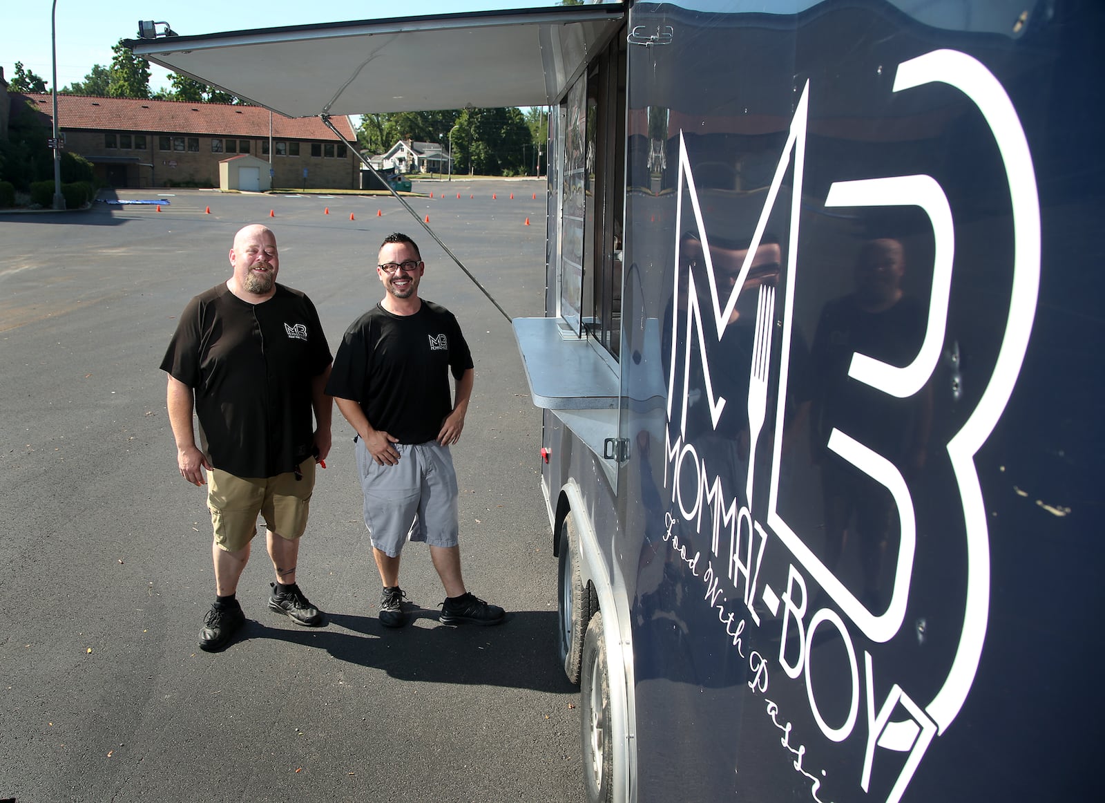 Matt Black (left) and Josh Chavez are the owners of Momma's Boyz, a Dayton food trailer. LISA POWELL / STAFF