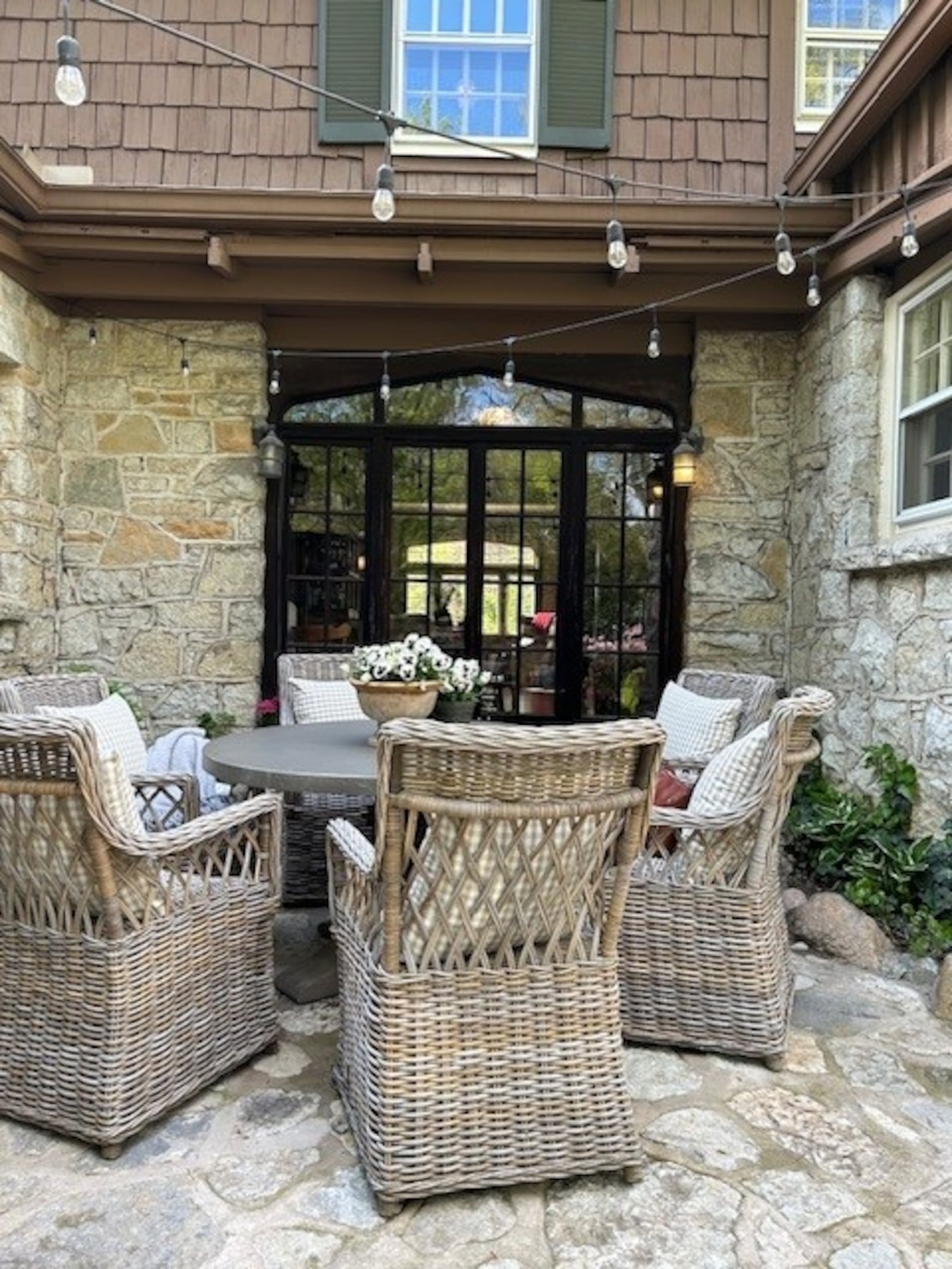 One of Sarena Kelley’s first projects at her Oakwood home was this patio, using stones that match the house. It creates one of the “vignettes” that Kelley says are key to creating great outdoor parties. JANA COLLIER/CONTRIBUTED 