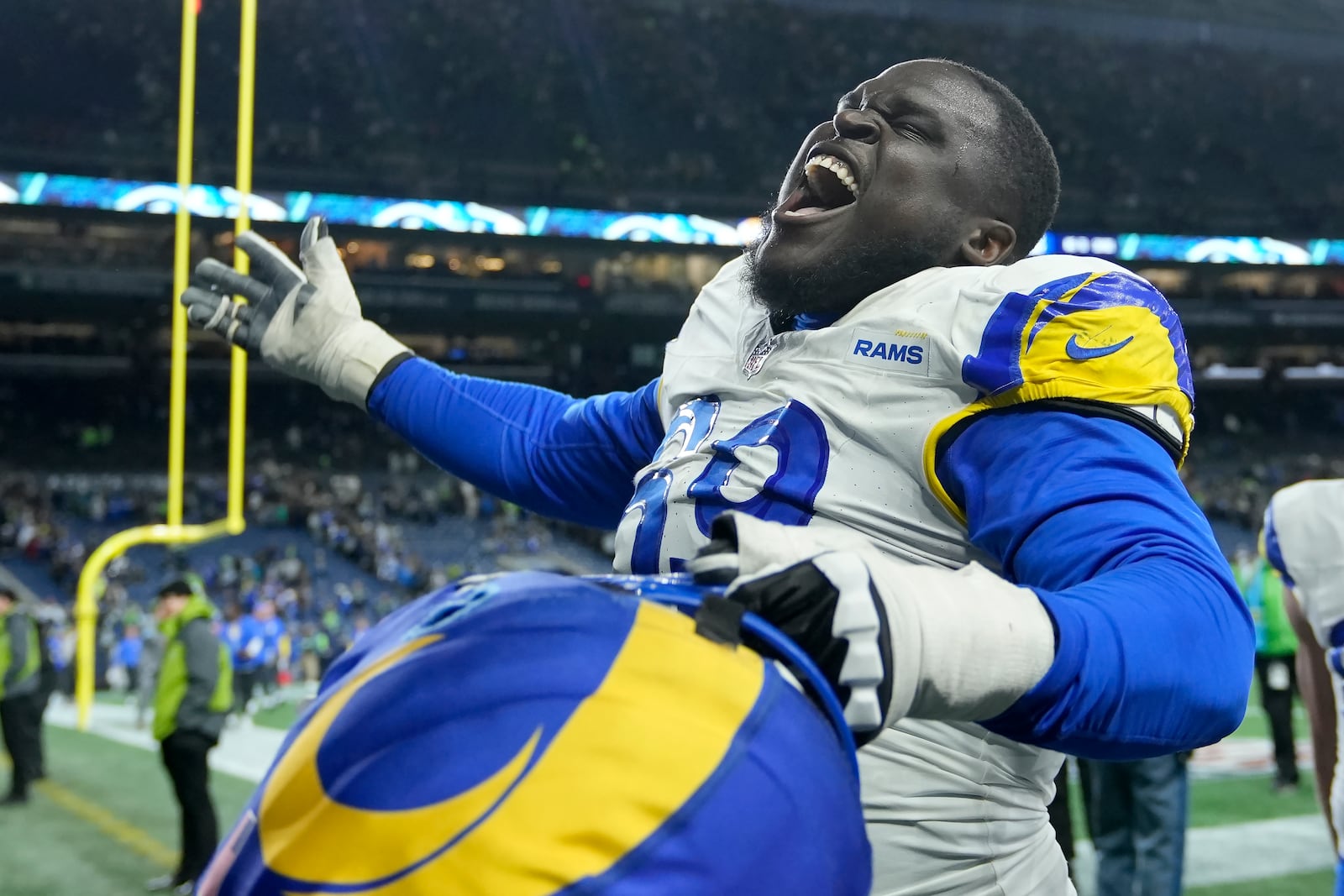 Los Angeles Rams guard Kevin Dotson celebrates after the Rams defeated the Seattle Seahawks in overtime of an NFL football game in Seattle, Sunday, Nov. 3, 2024. (AP Photo/Stephen Brashear)