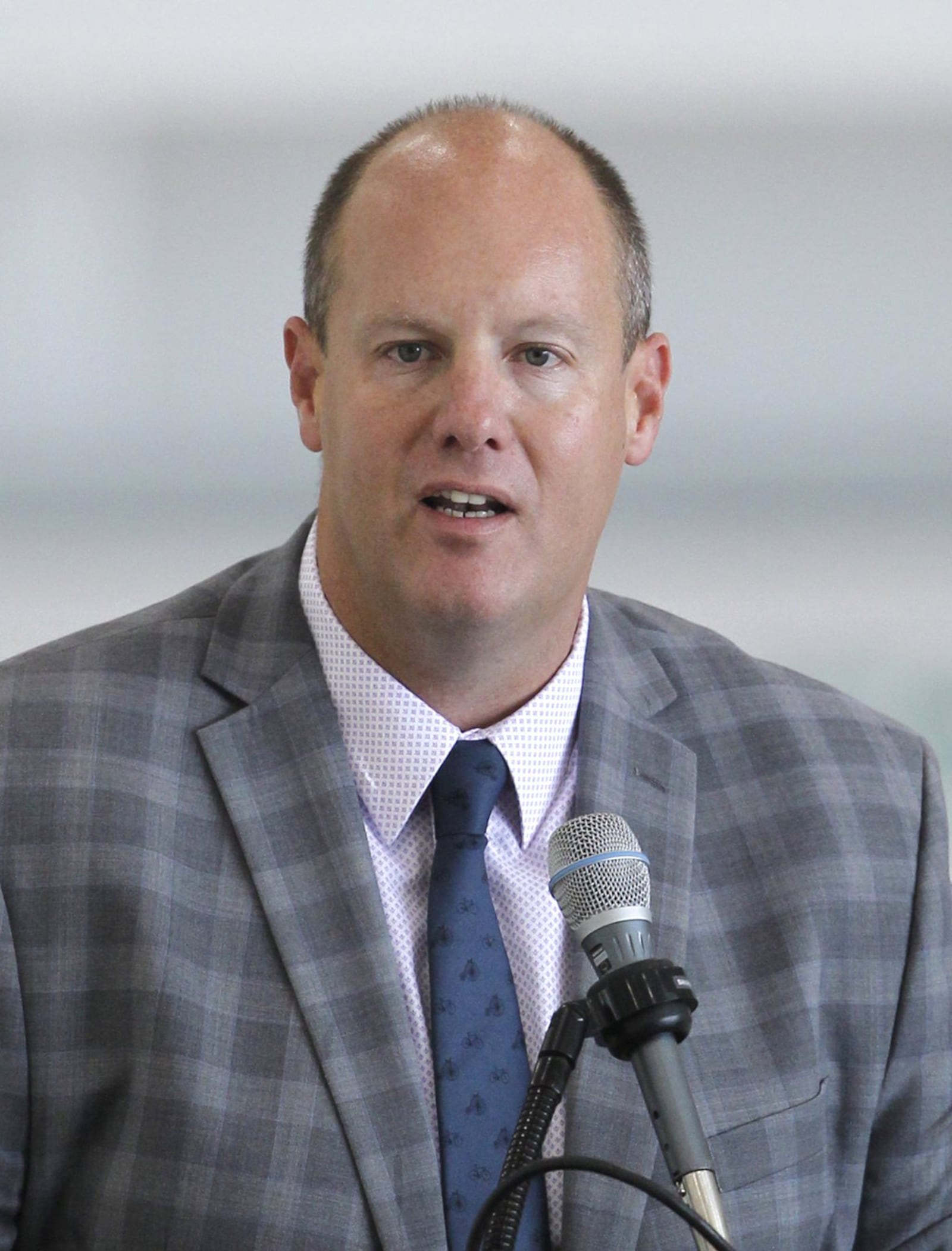 Chris Kershner, executive vice president, Dayton Chamber of Commerce opened a Chamber meeting at the Dayton Airport where candidates for Ohio Governor spoke on Thursday, August 16. TY GREENLEES / STAFF