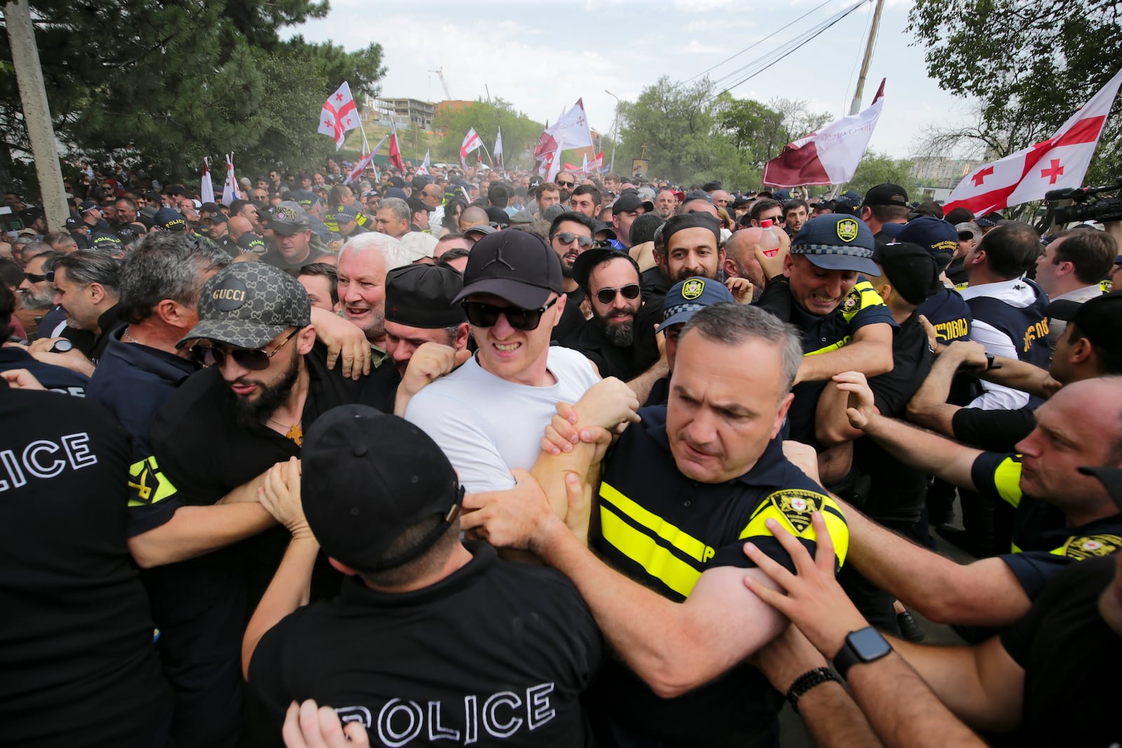 FILE - Police block opponents of gay rights as they try to interfere a pride event in Tbilisi, Georgia, on July 8, 2023. (AP Photo/Zurab Tsertsvadze, File)