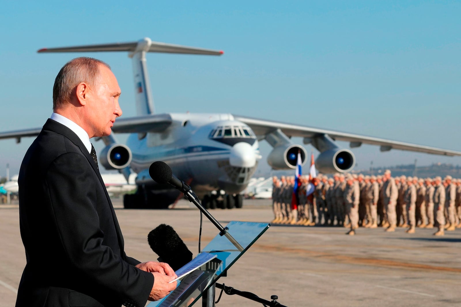 FILE - Russian President Vladimir Putin addresses troops at the Hemeimeem air base in Syria on Dec. 11, 2017. (Mikhail Klimentyev, Sputnik, Kremlin Pool Photo via AP, File)