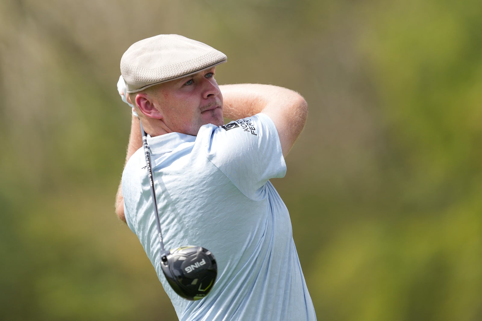 Harry Hall, of England, watches his tee shot on the second hole during the second round of the Mexico Open golf tournament in Puerto Vallarta, Mexico, Friday, Feb. 21, 2025. (AP Photo/Fernando Llano)