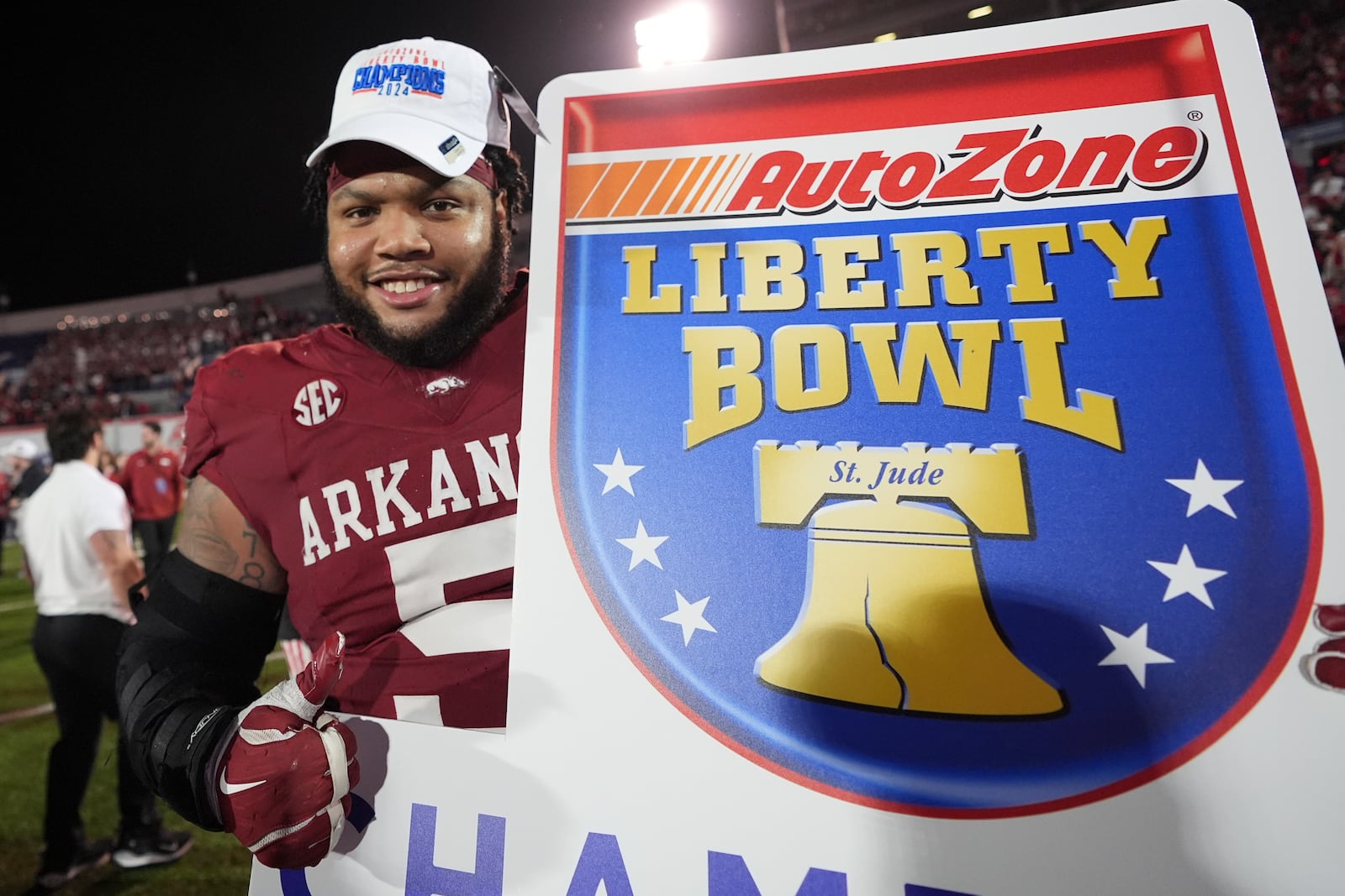 Arkansas defensive lineman Cameron Ball (5) celebrates the team's win after the Liberty Bowl NCAA college football game against Texas Tech, Friday, Dec. 27, 2024, in Memphis, Tenn. (AP Photo/George Walker IV)